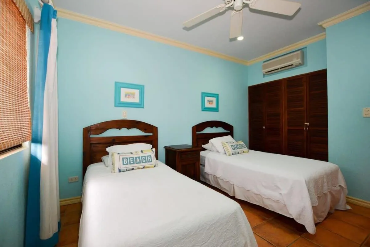Bed in Elegant 3BR Beachfront Condo with Spacious Interior, Ocean-View Terrace & Direct Access to Playa Flamingo