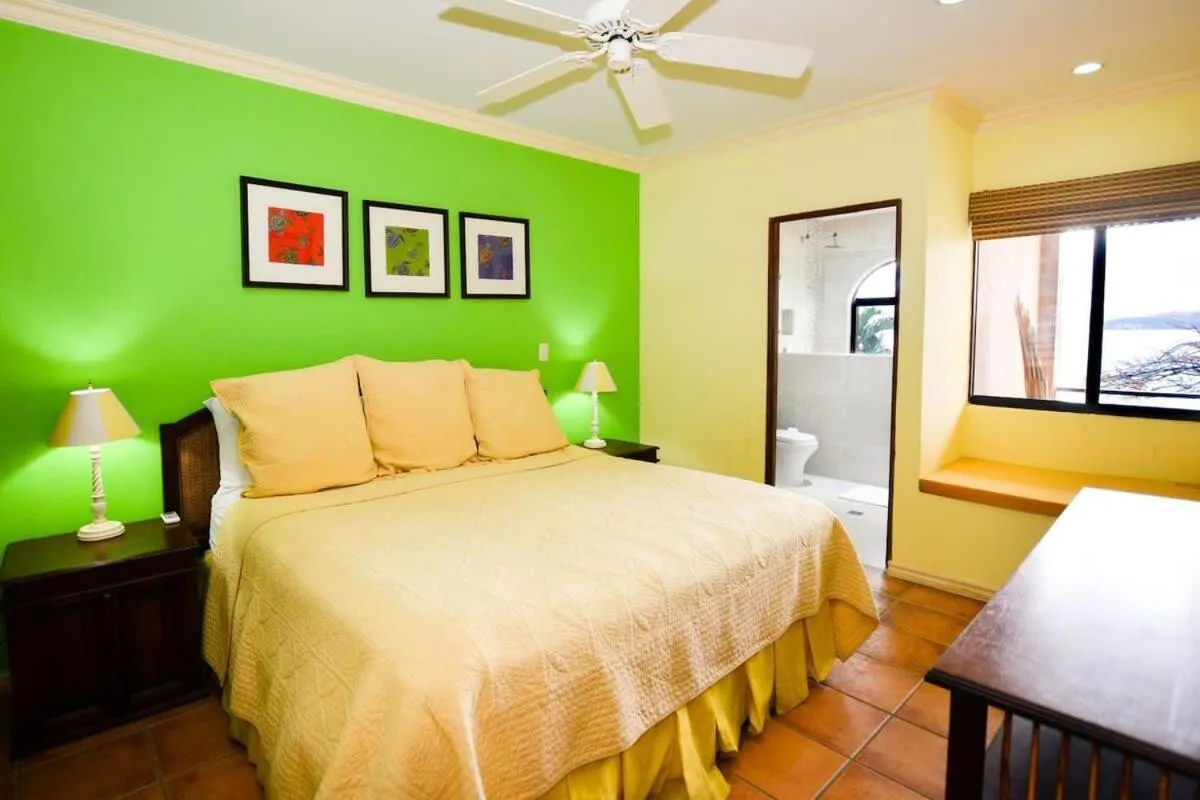 Bed in Elegant 3BR Beachfront Condo with Spacious Interior, Ocean-View Terrace & Direct Access to Playa Flamingo