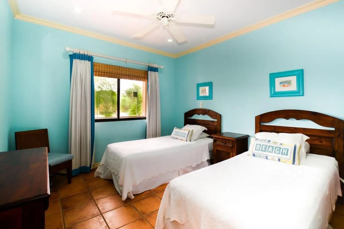 Bed in Elegant 3BR Beachfront Condo with Spacious Interior, Ocean-View Terrace & Direct Access to Playa Flamingo
