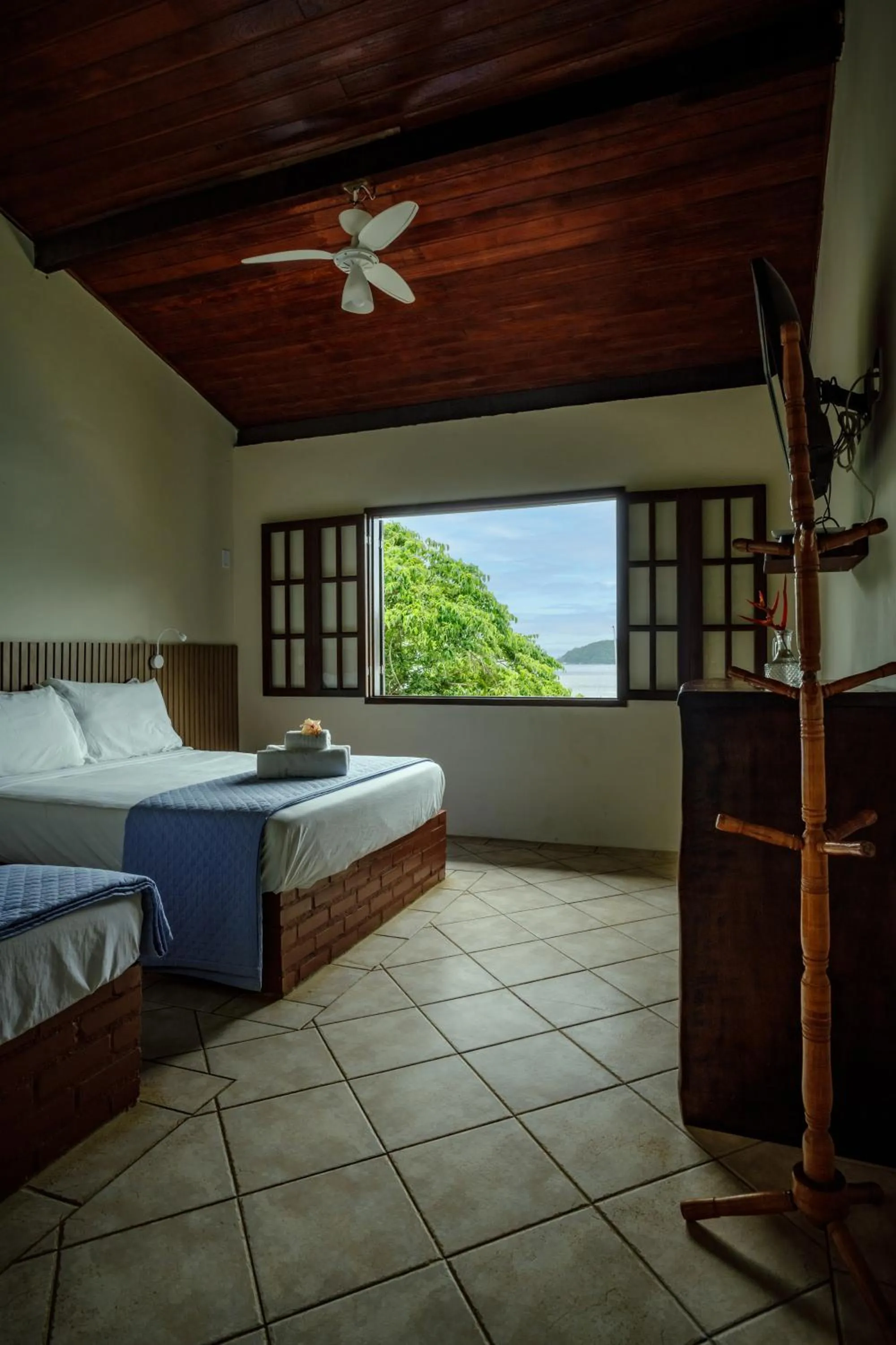 Bed in Pousada Cruzoé