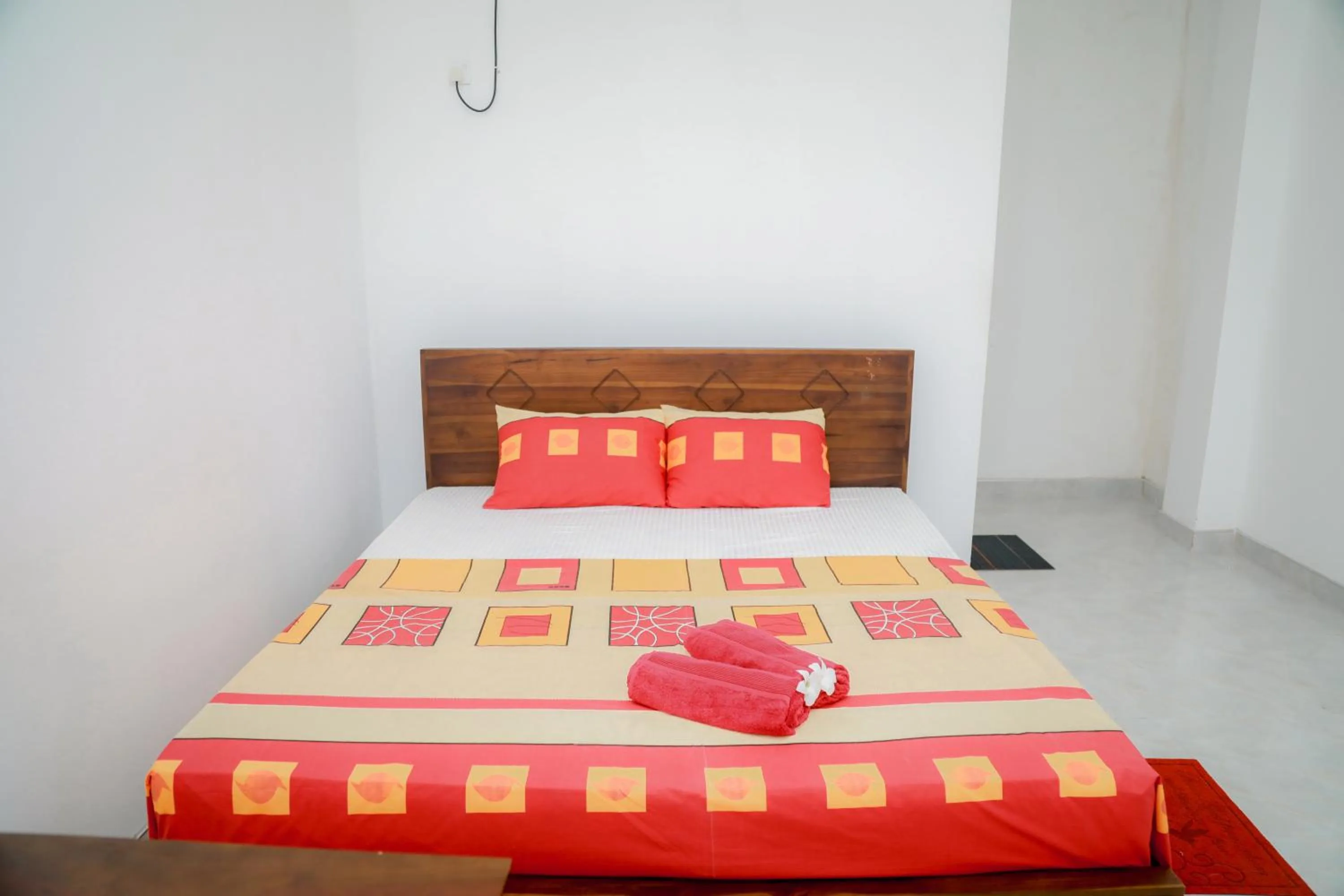 Bed in Araliya Lagoon Park Resort