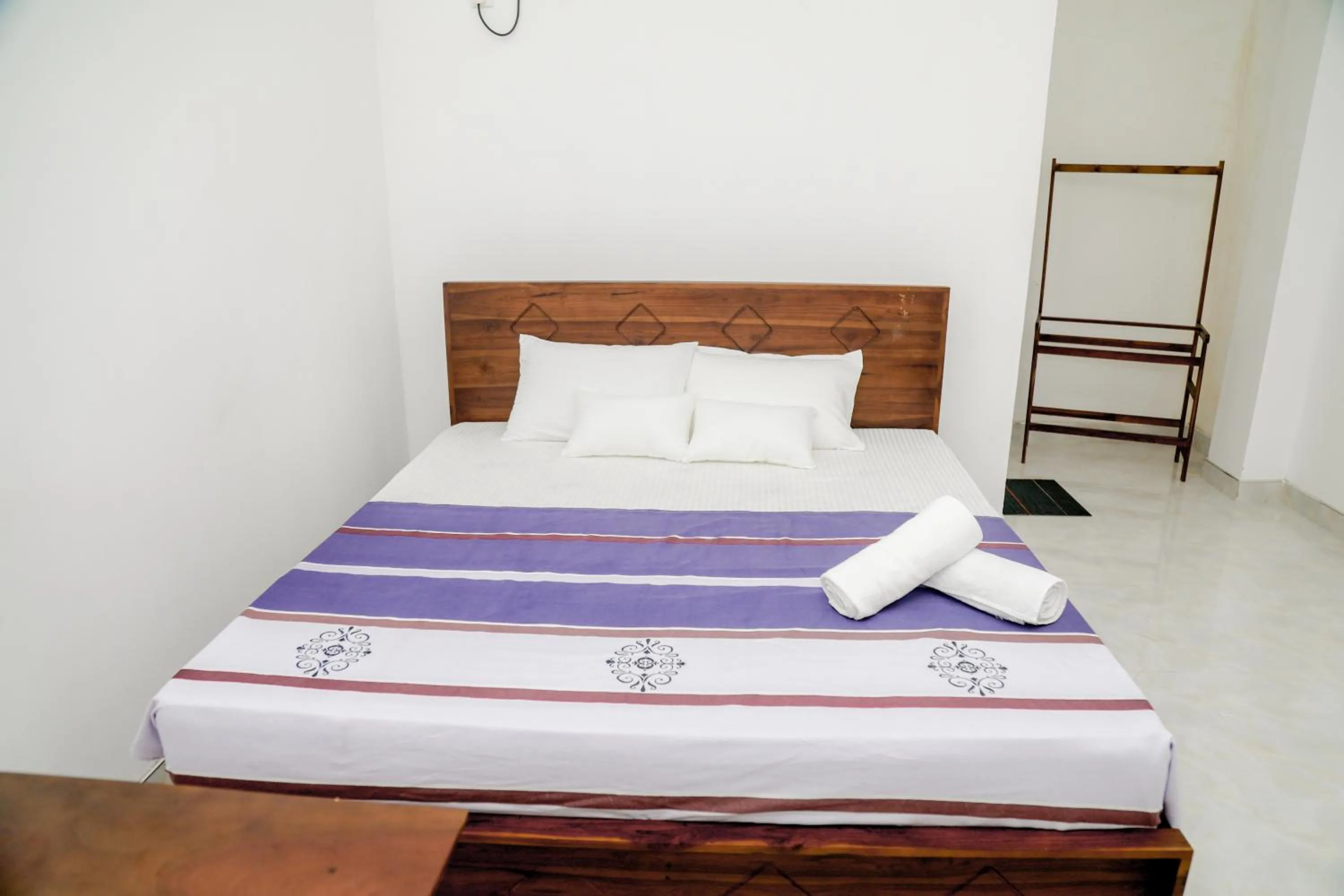 Bed in Araliya Lagoon Park Resort