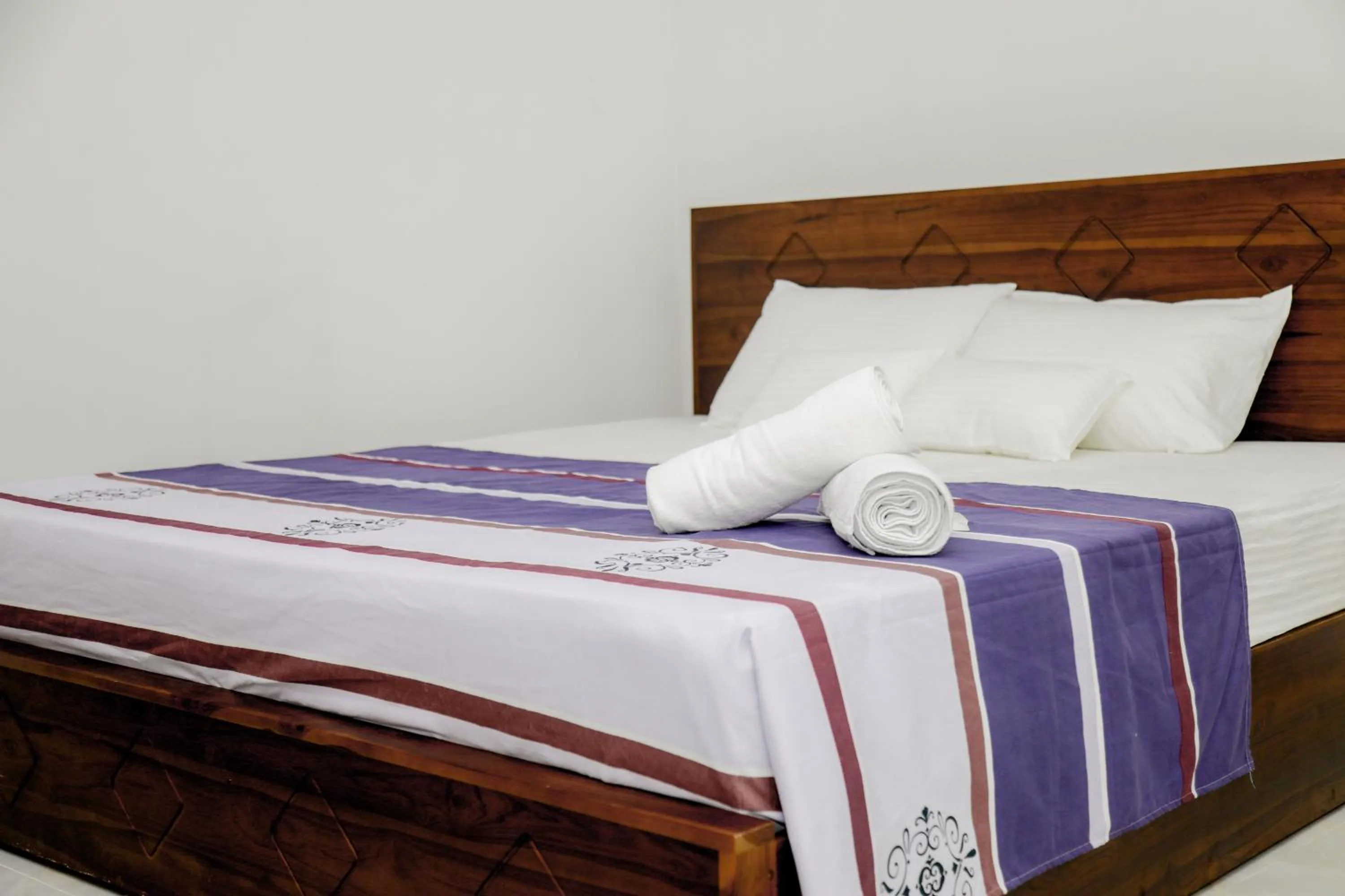 Bed in Araliya Lagoon Park Resort