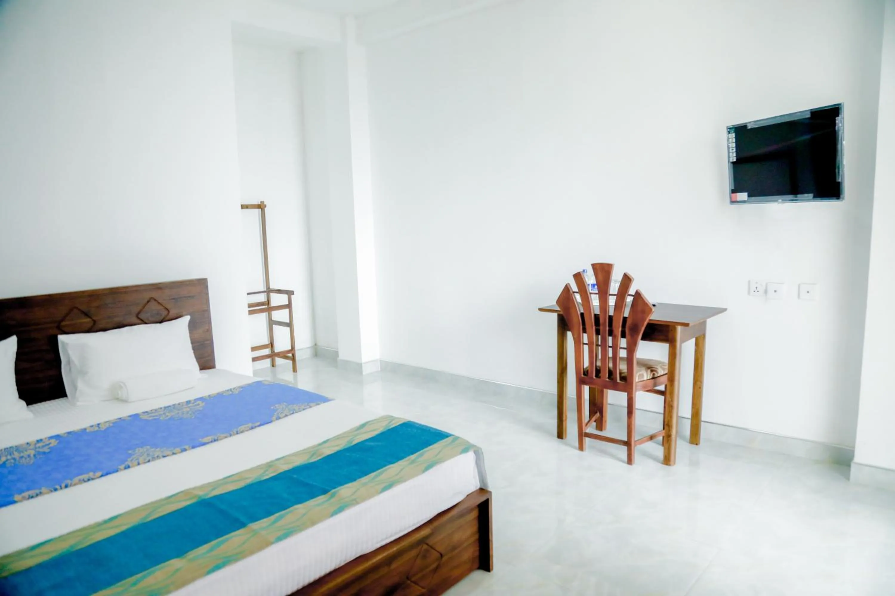 Bed in Araliya Lagoon Park Resort