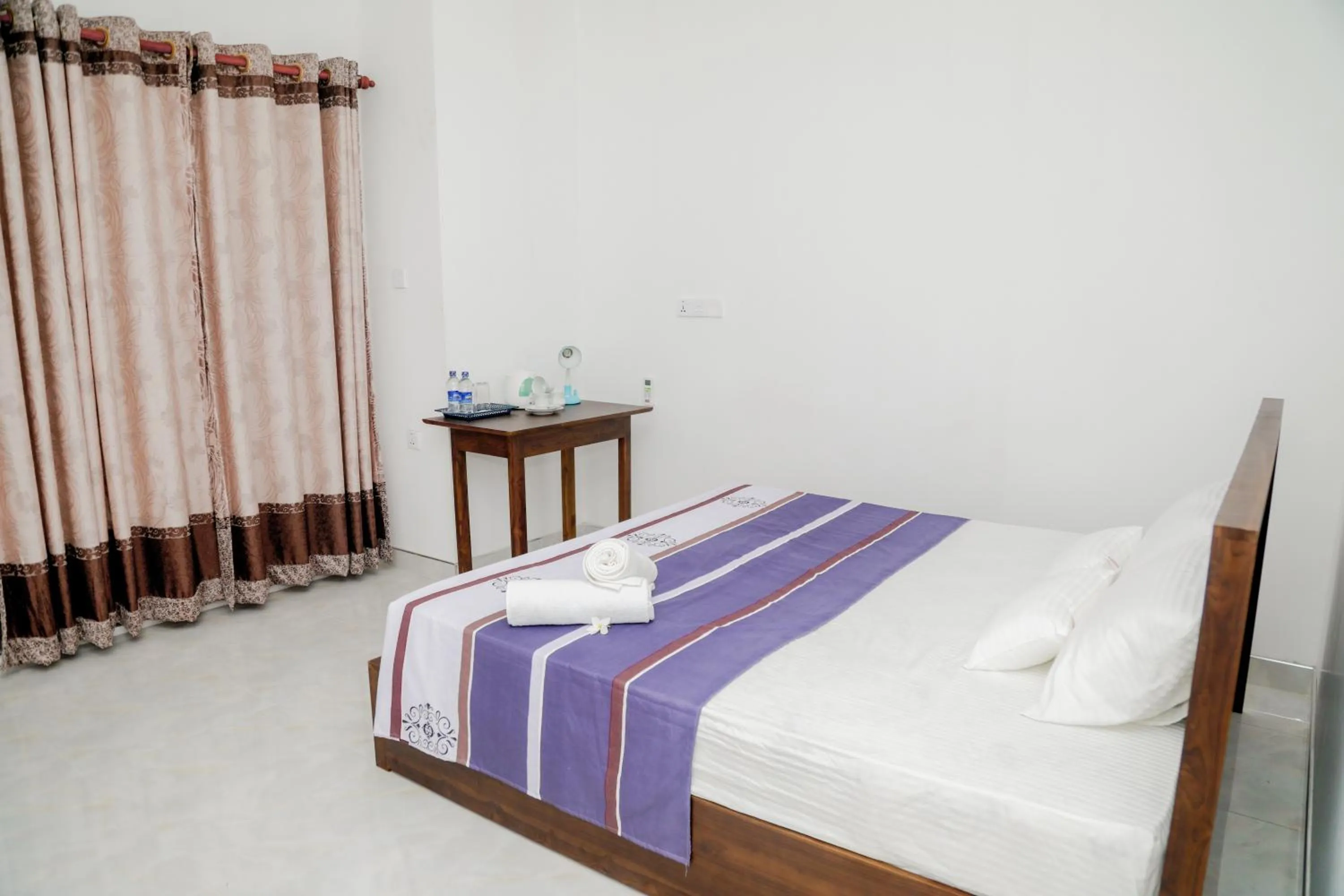 Bed in Araliya Lagoon Park Resort