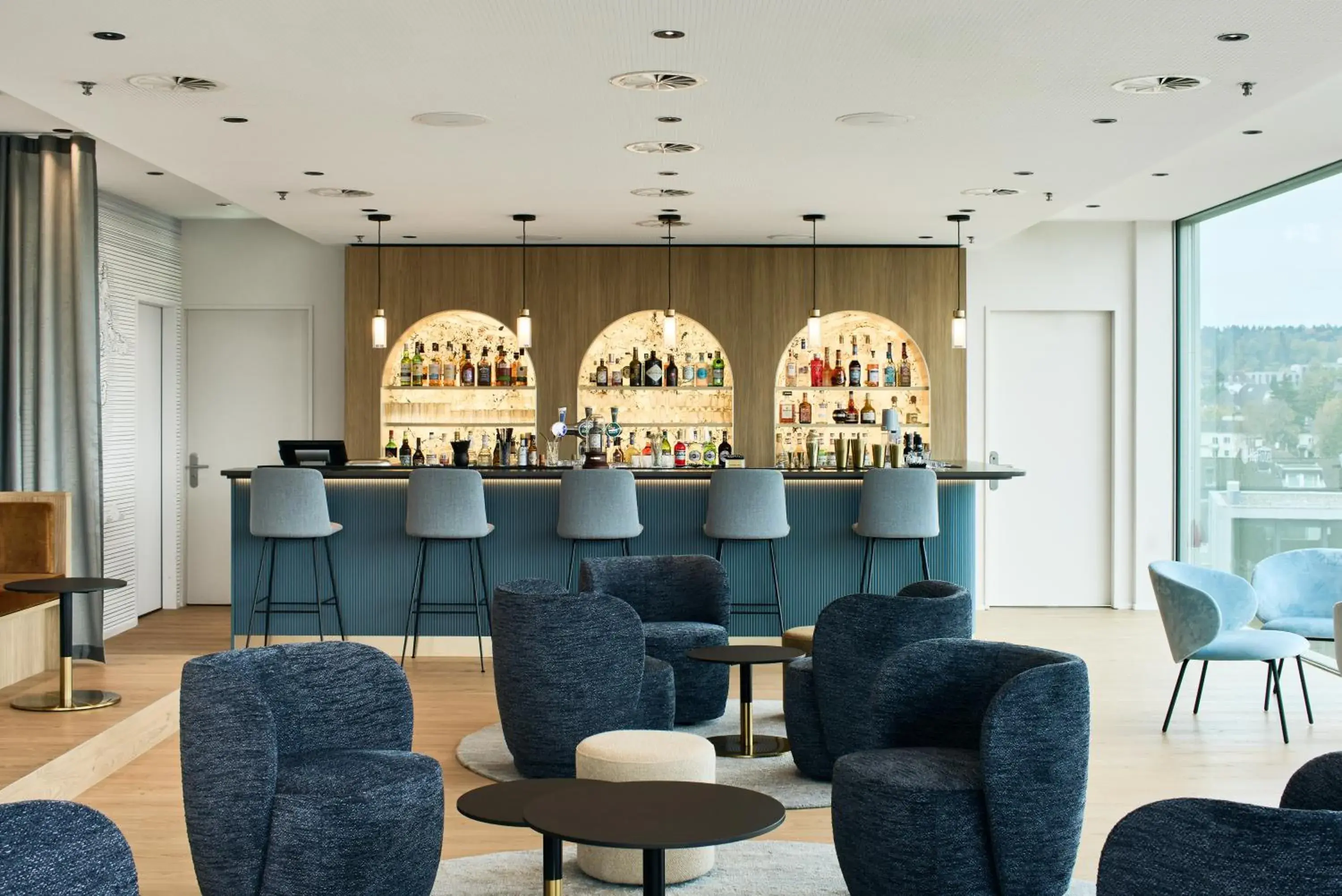 Lounge or bar in H4 Hotel Solothurn Lounge or bar in H4 Hotel Solothurn