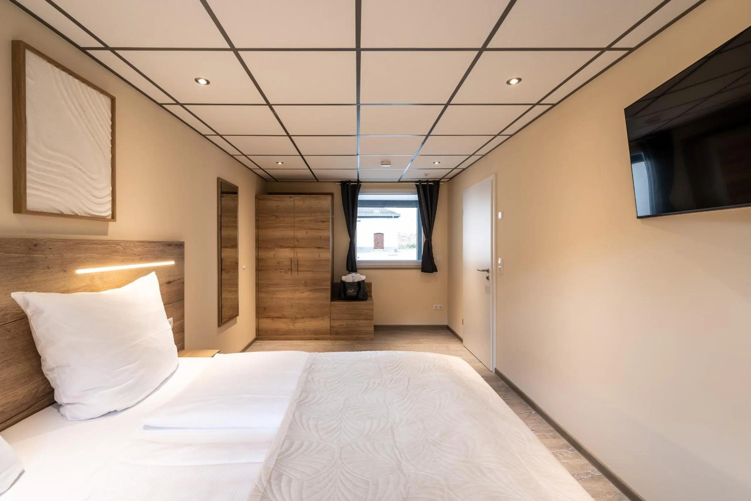 Bed in Apart Hotel Lang