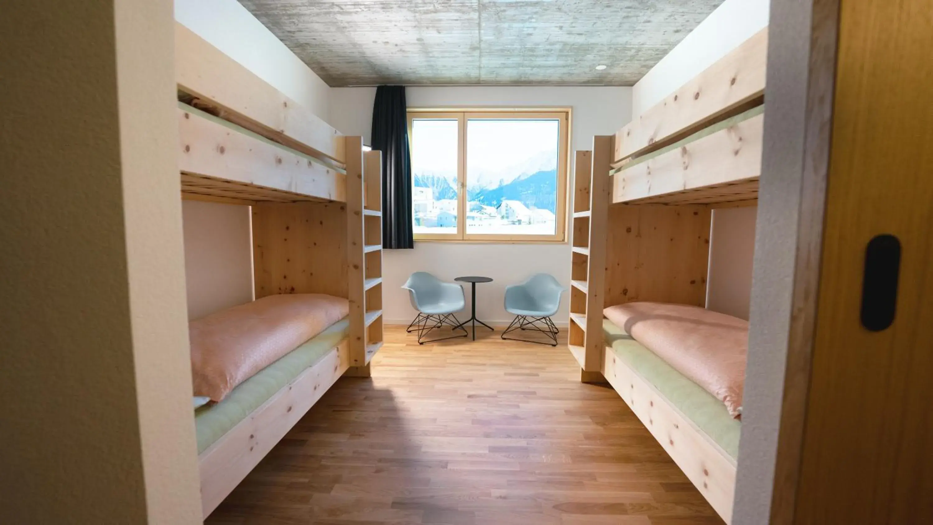 Quadruple Room with Shared Bathroom - incl. Pool Access in Laax wellnessHostel3000 Quadruple Room with Shared Bathroom - incl. Pool Access in Laax wellnessHostel3000
