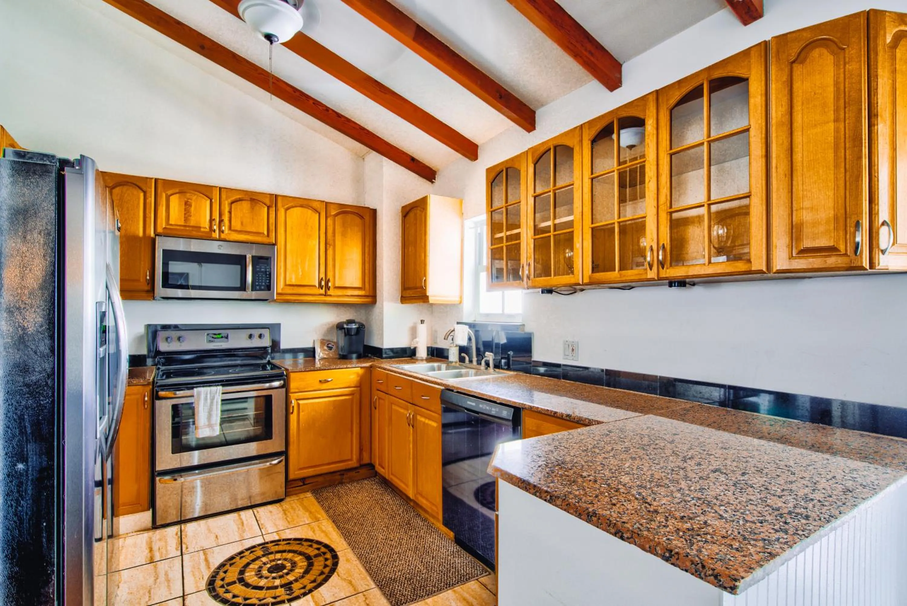 Kitchen or kitchenette in Little Paris by the ocean self check in