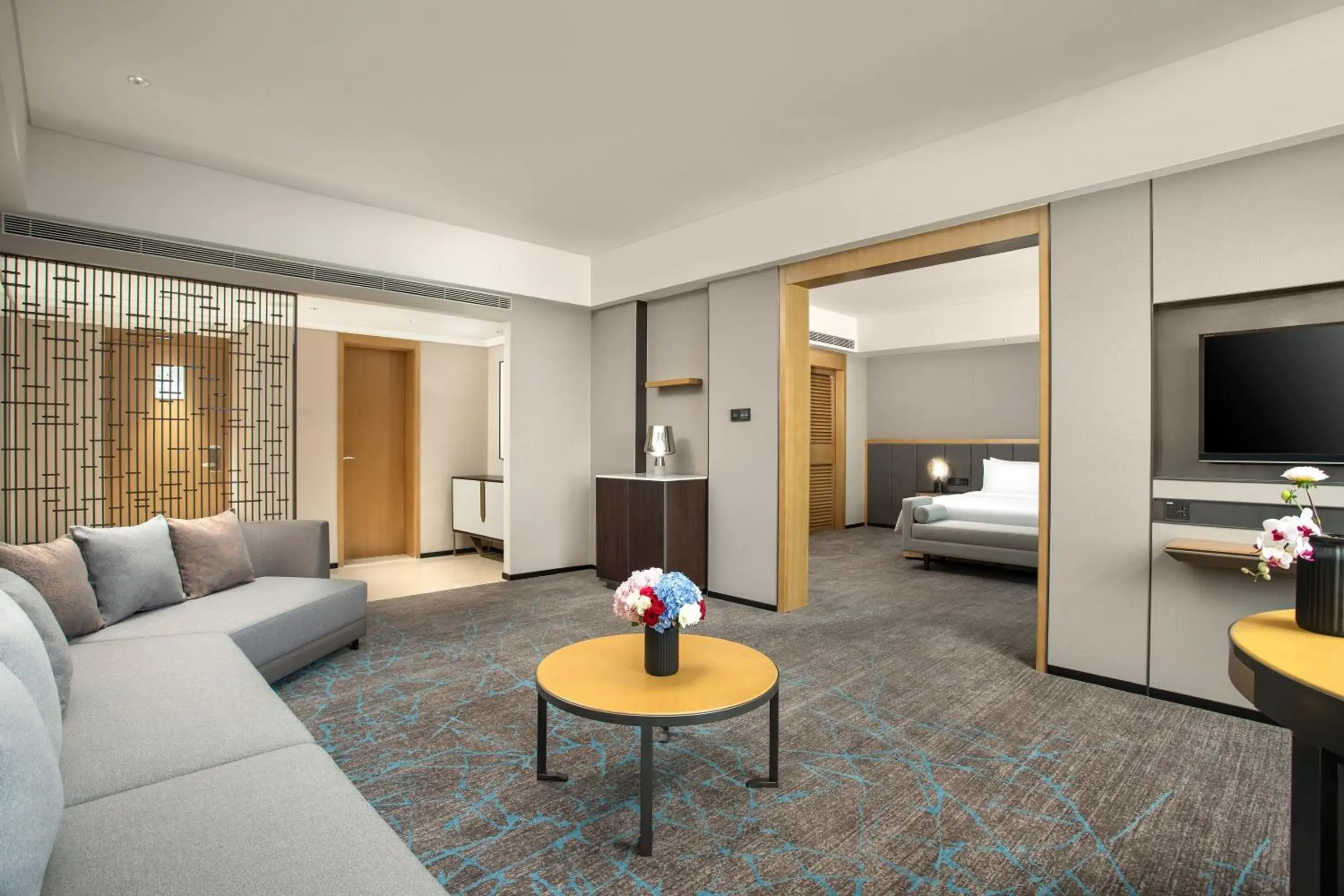 Living room, Bed in Crowne Plaza Shanghai Fudan by IHG Living room, Bed in Crowne Plaza Shanghai Fudan by IHG