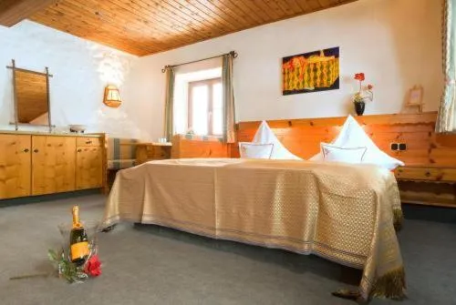 Seating area, Bed in Landhotel Binderhäusl Garni