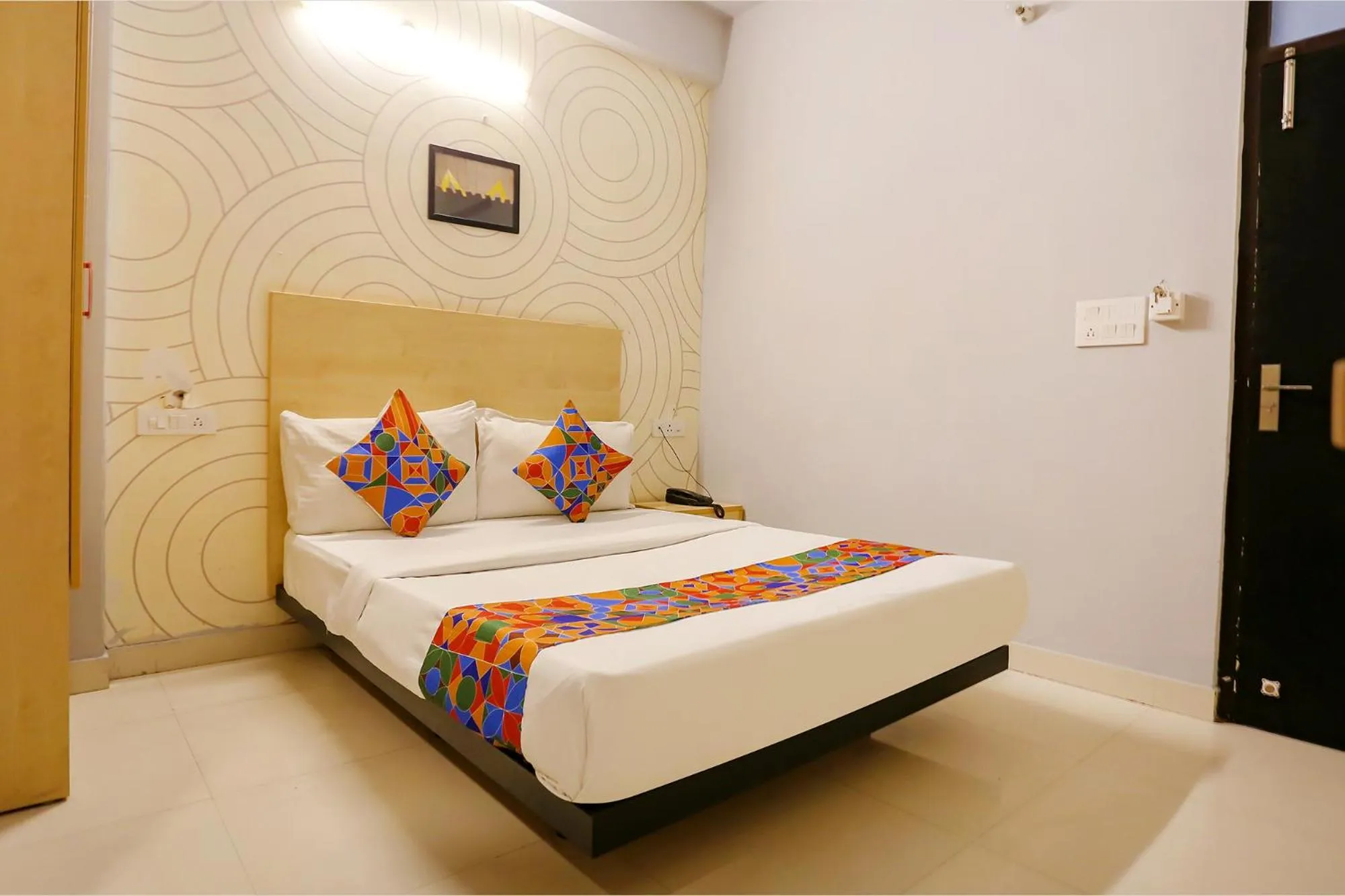 Bed in FabHotel Grand Capitol