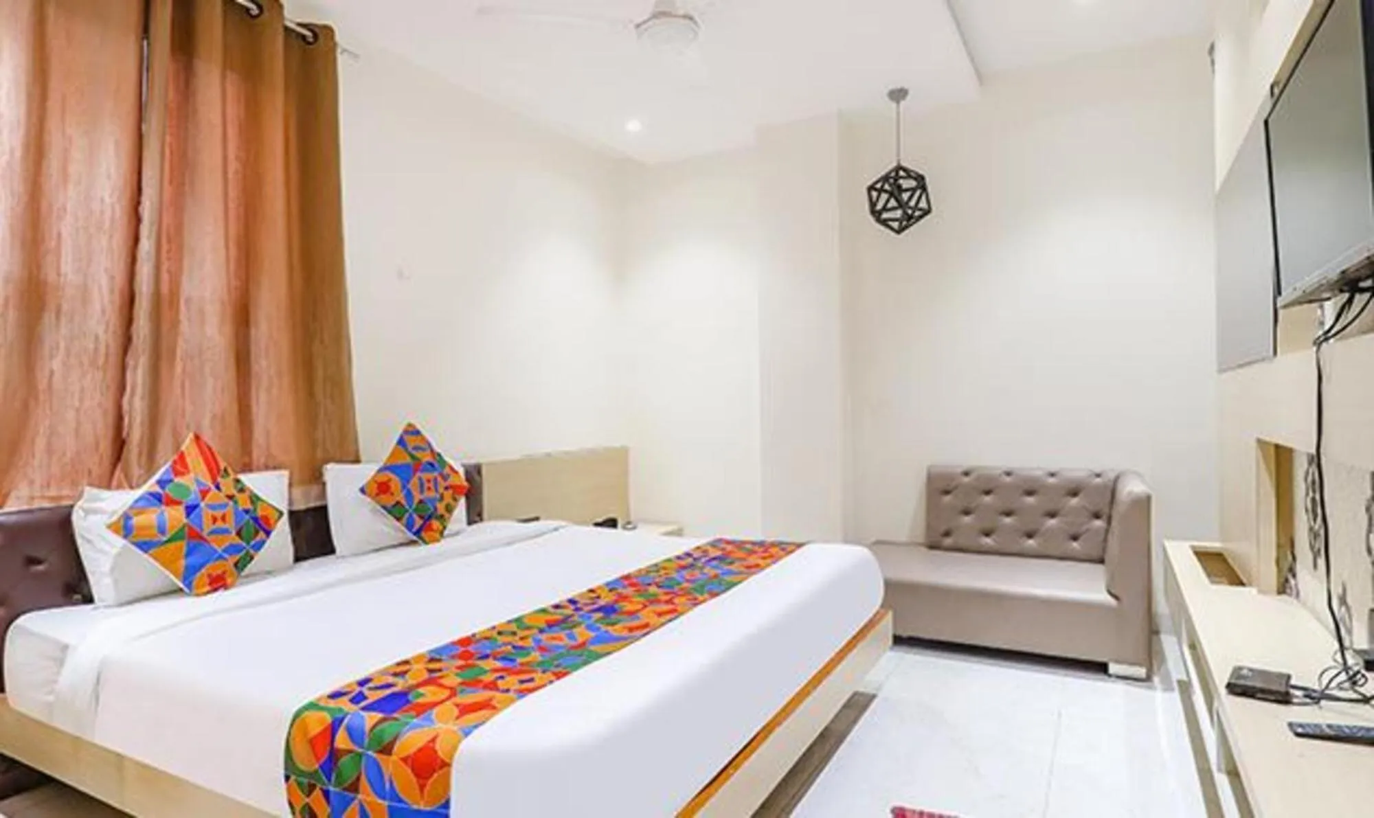 Seating area, Bed in FabHotel Grand Capitol