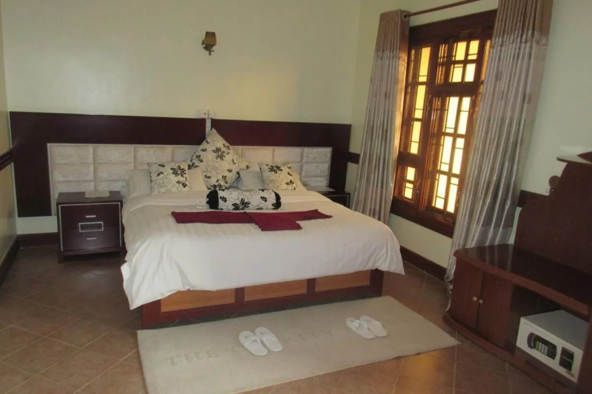 Bed in New Charity Hotel International