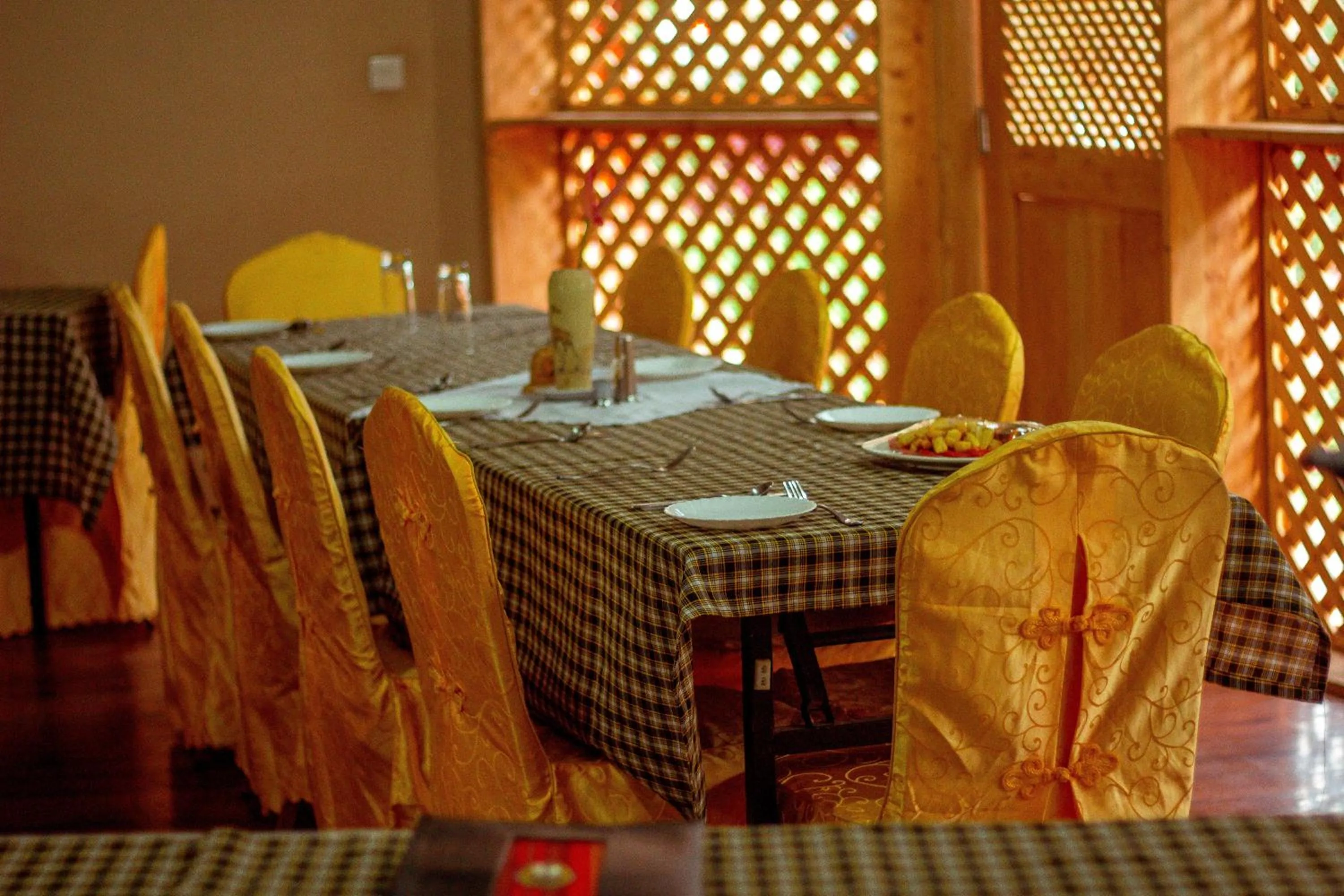 Dining area in New Charity Hotel International
