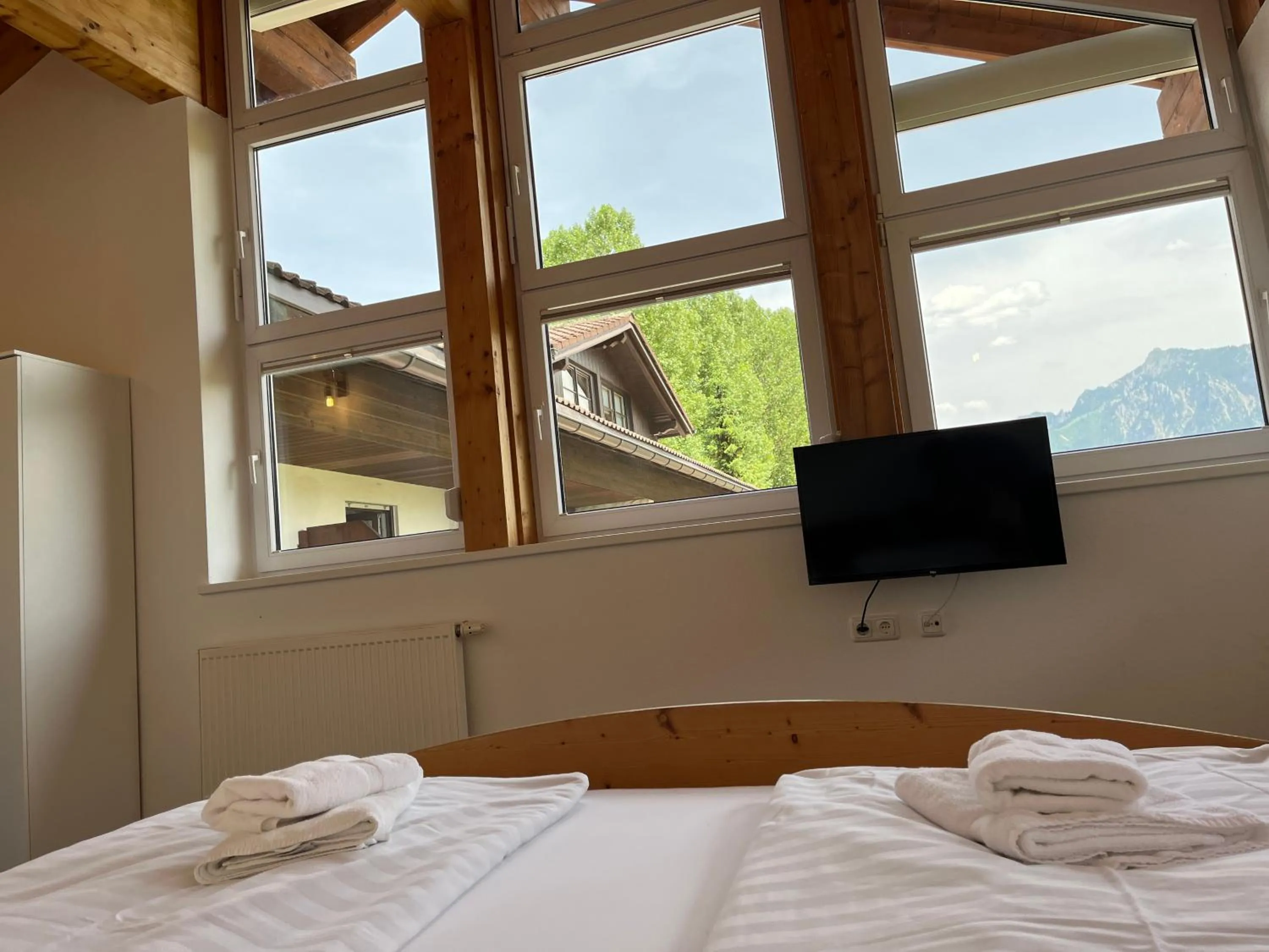 Photo of the whole room, Bed in Gästehaus Forggensee