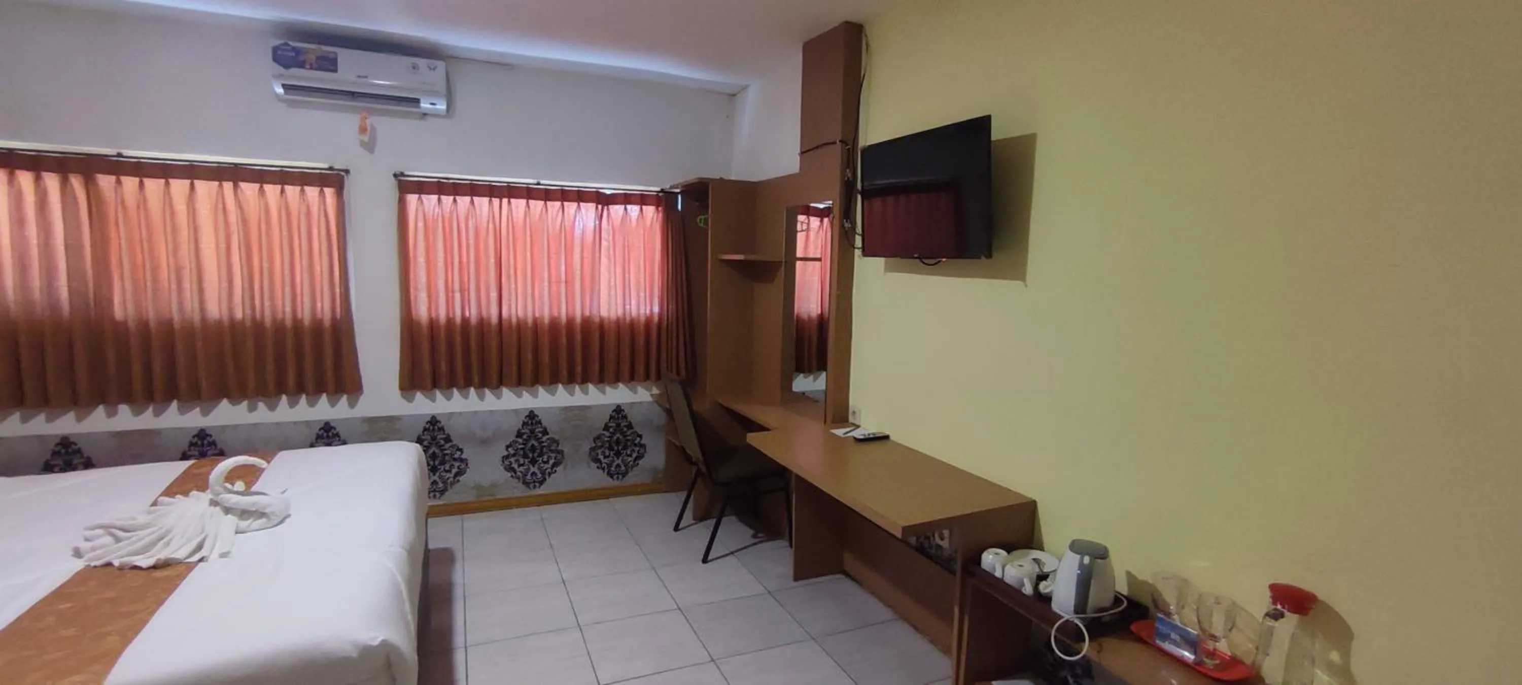 Bed in Votel Hotel De'Pratnya Kediri