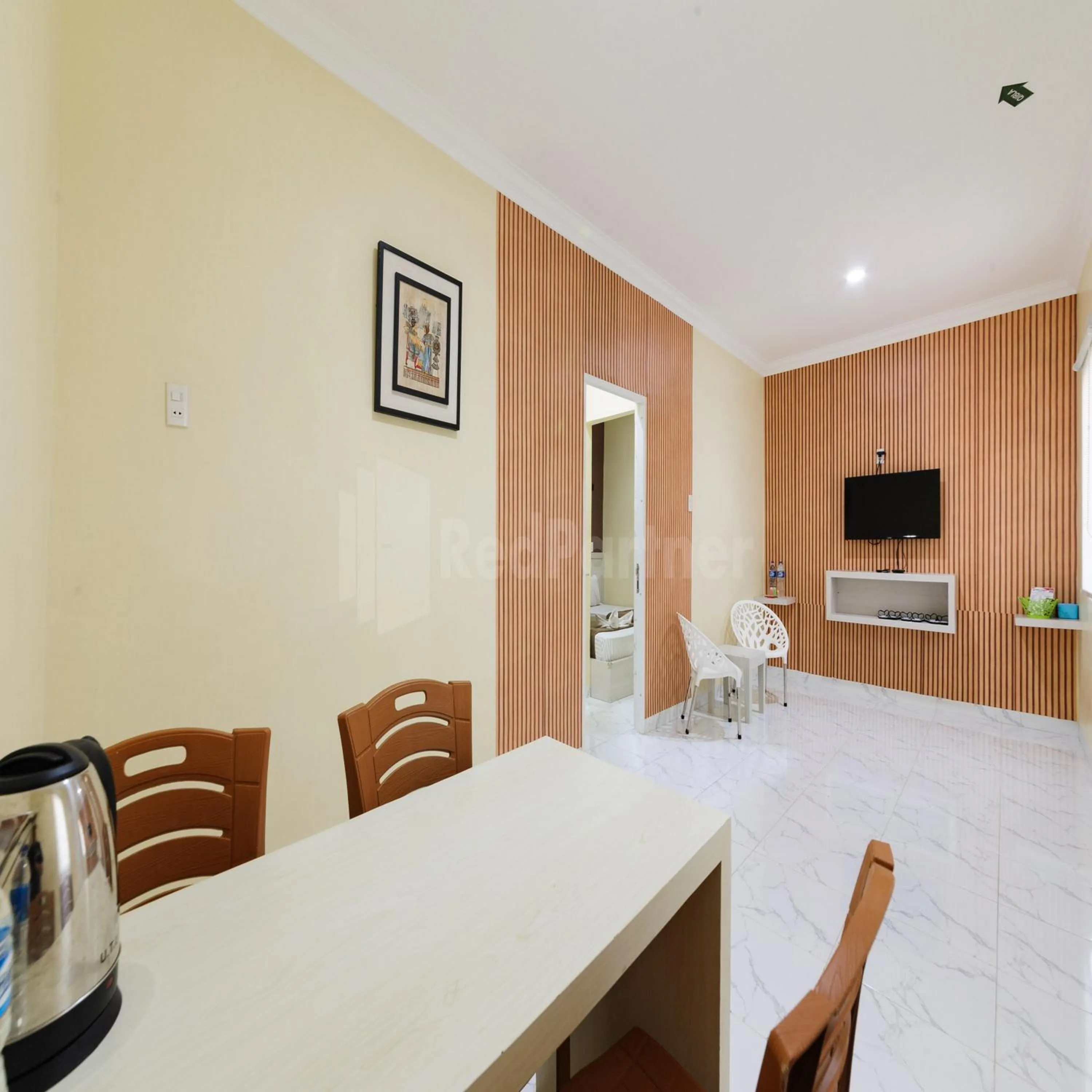 Seating area in Hotel 78 Parapat Mitra RedDoorz