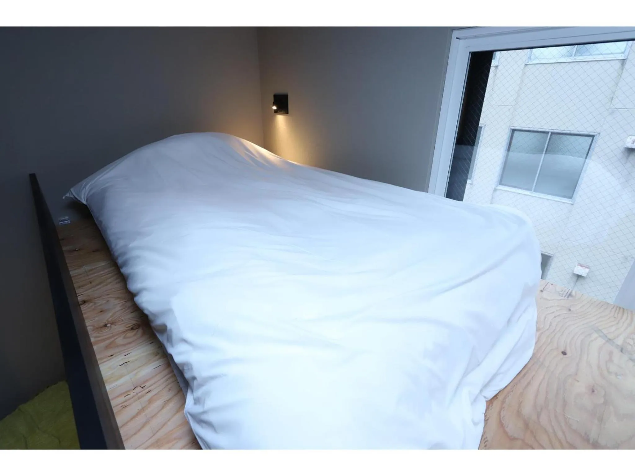 Bed in Uchi Living Stay AOZORA