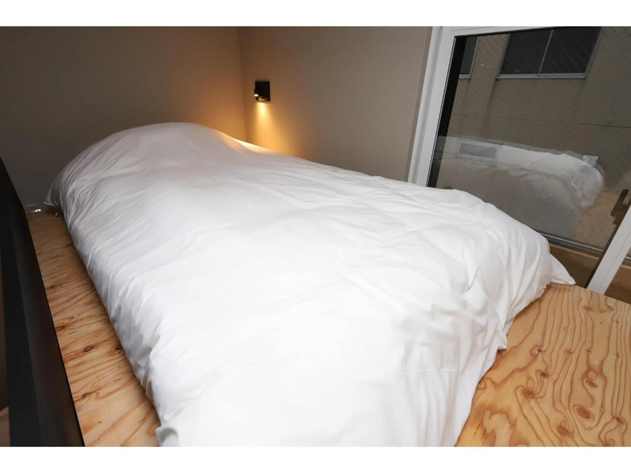 Bed in Uchi Living Stay AOZORA
