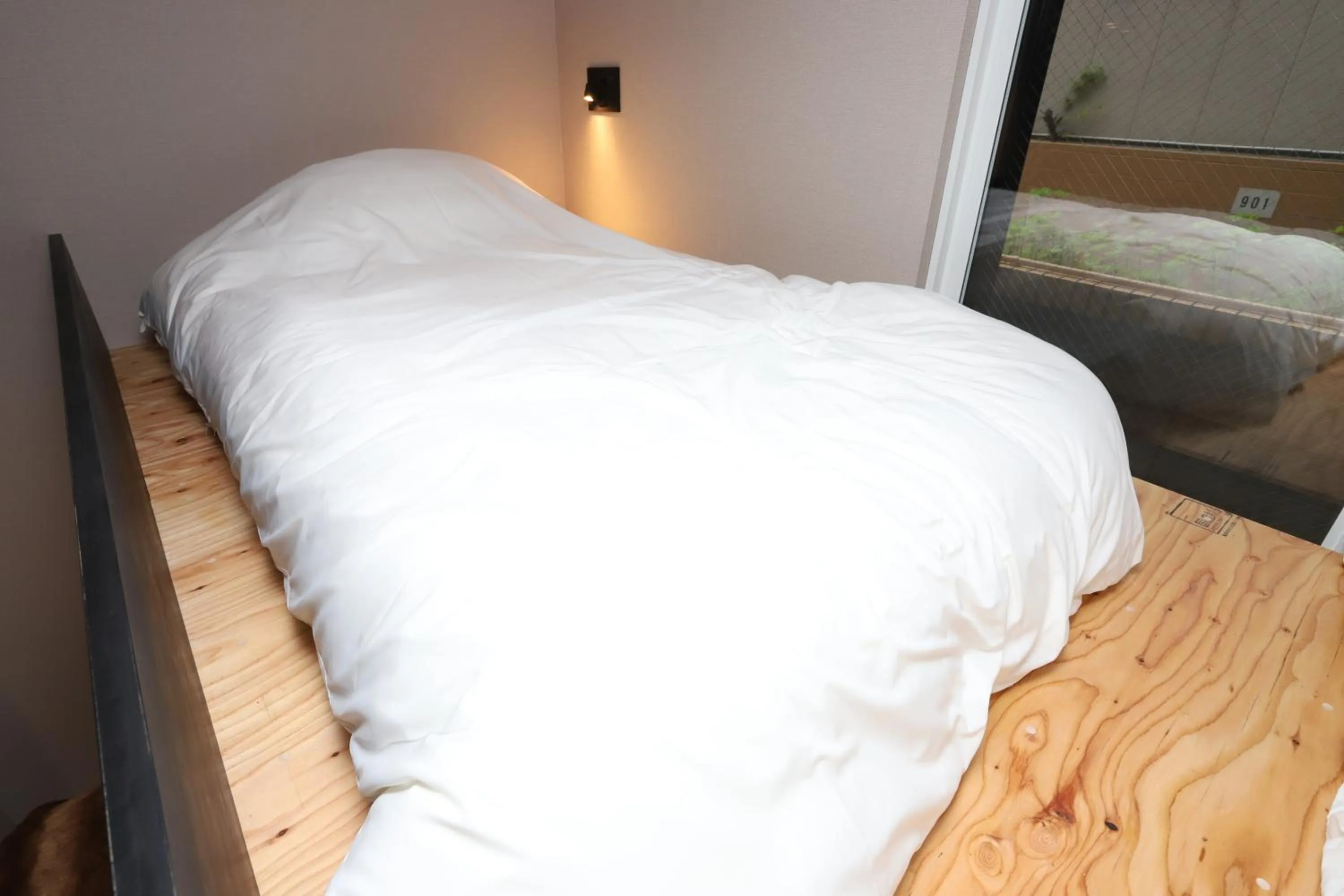 Bed in Uchi Living Stay AOZORA