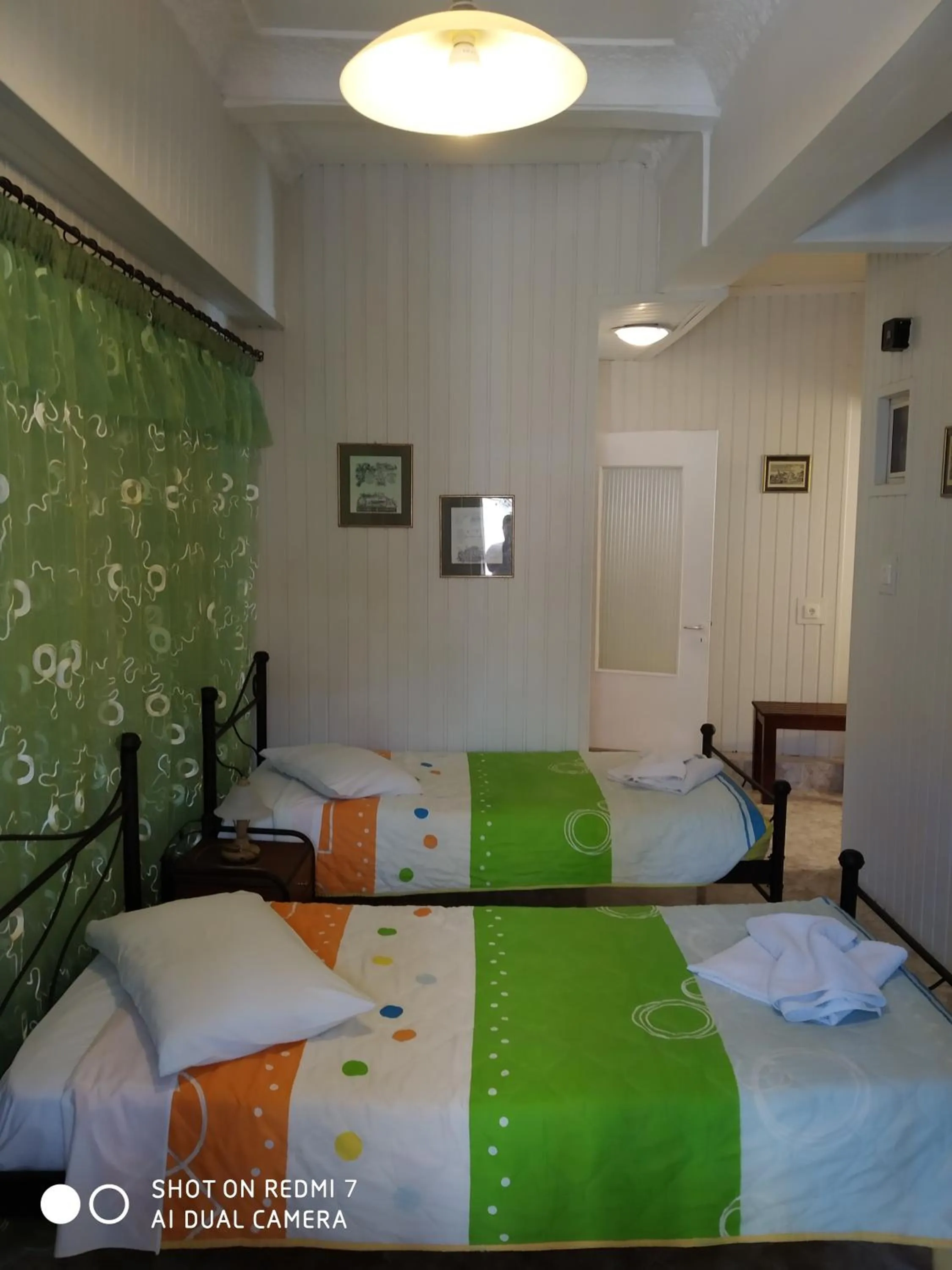 Bed in HERMOUPOLI ROOMS