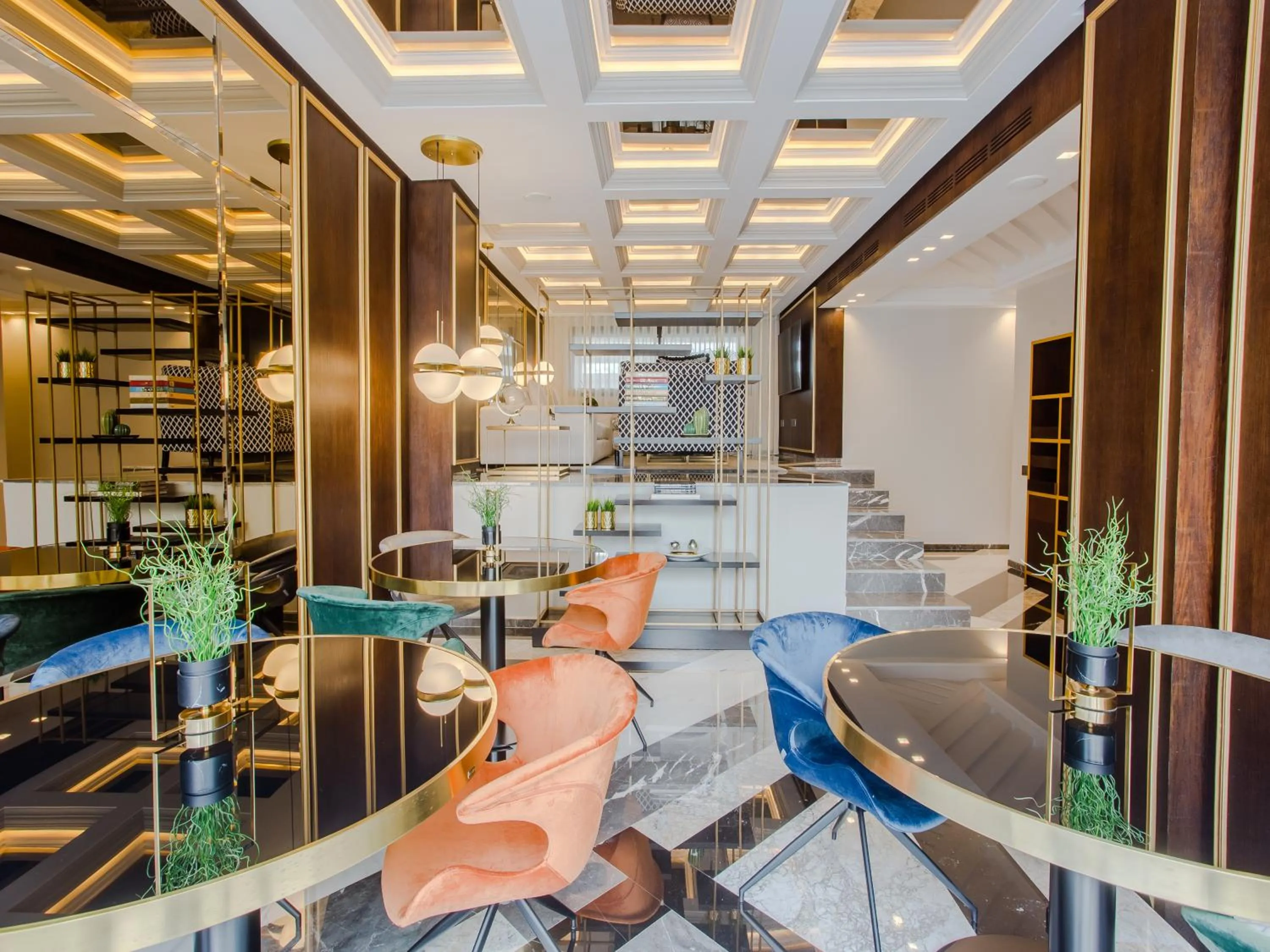 Communal lounge/ TV room in Makass Appart Hotel