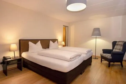 Bed in Posthotel Kolberbräu