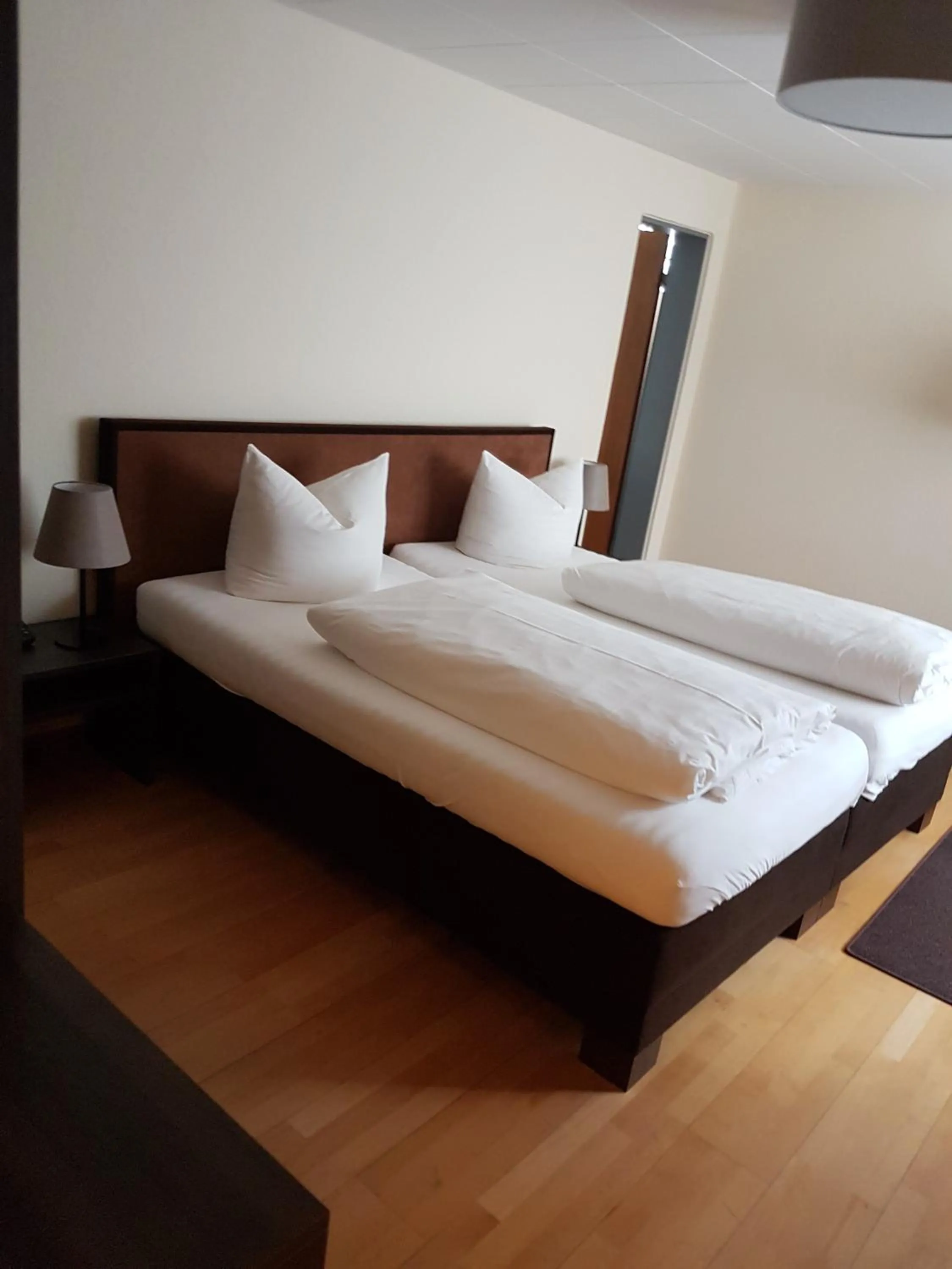 Bed in Posthotel Kolberbräu