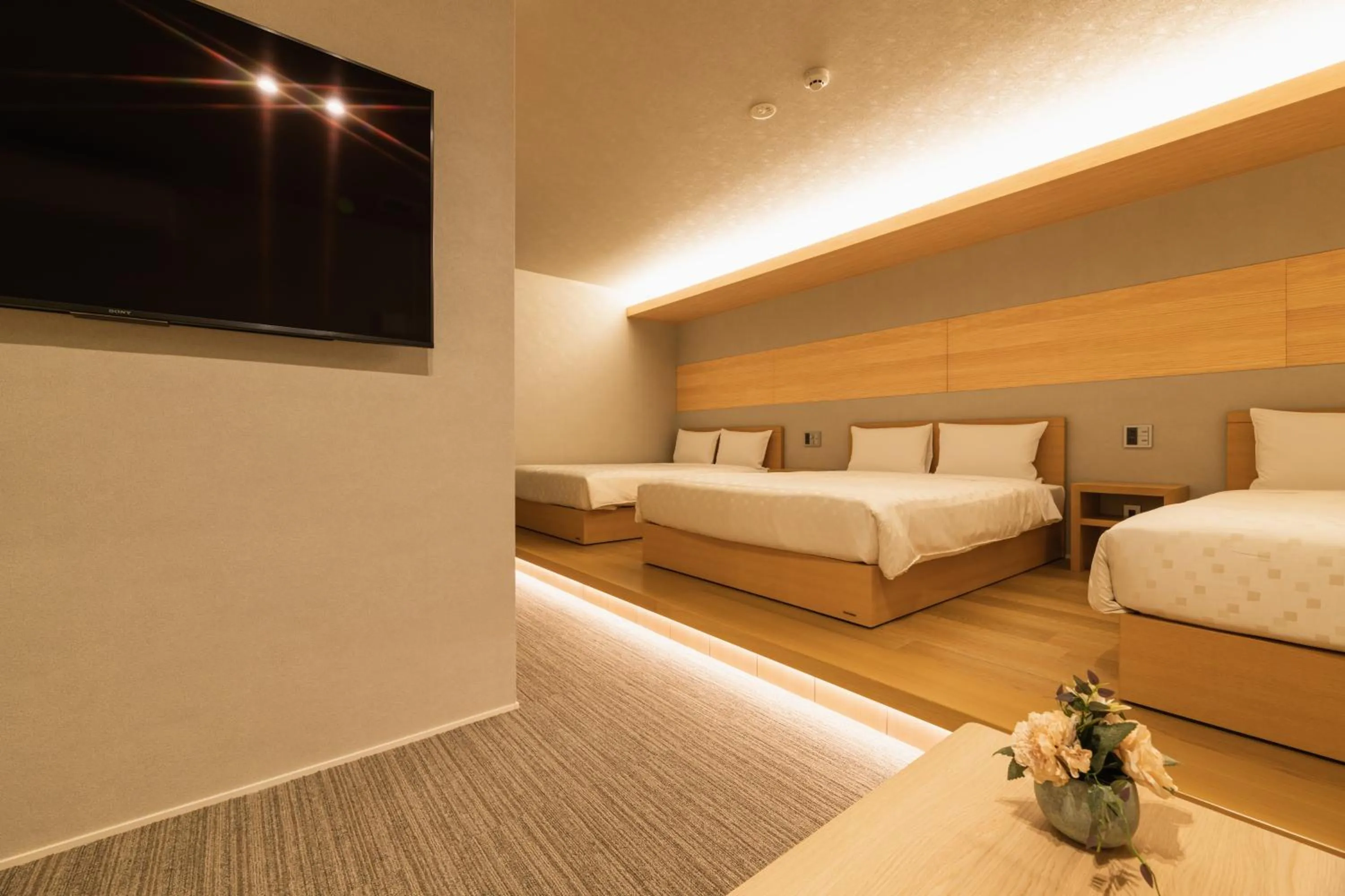 Photo of the whole room, Bed in GRAND BASE Hakata Station