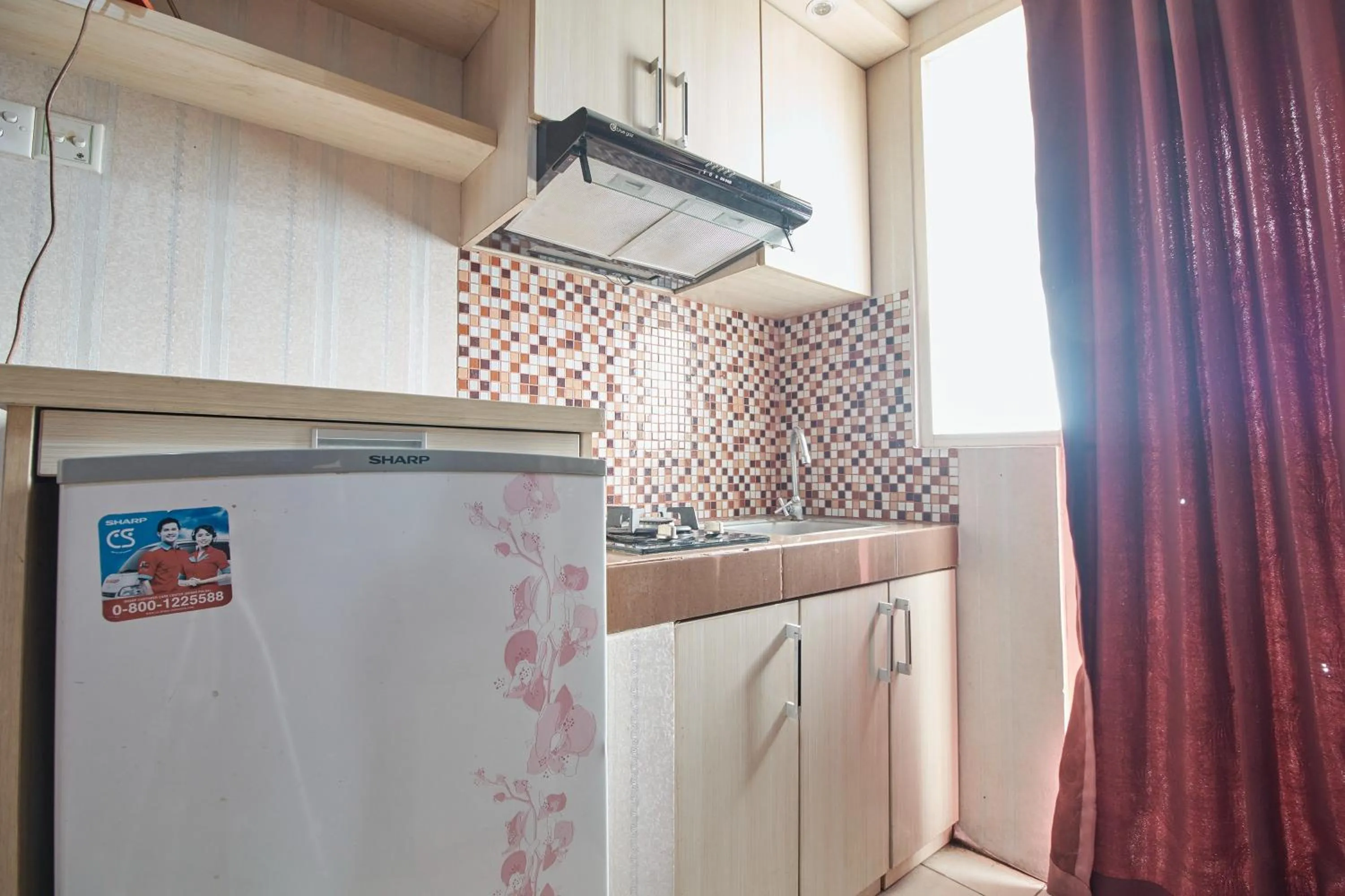 Kitchen or kitchenette in Apartment Green Lake View Ciputat by Celebrity Room