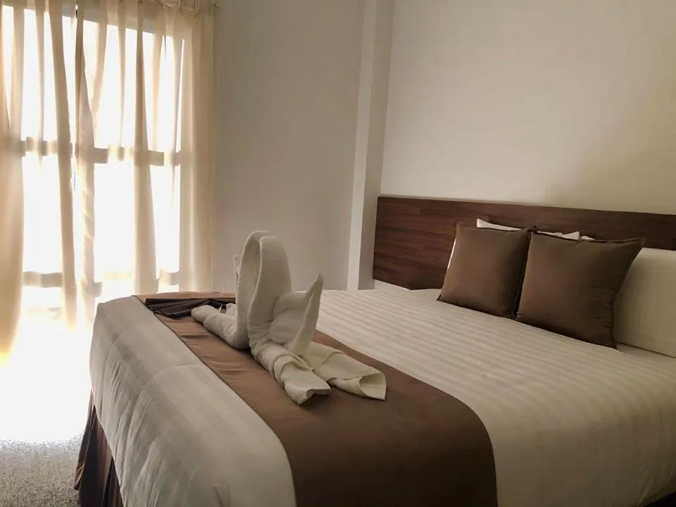 Bed in Seacliff Suites Hotel and Resort