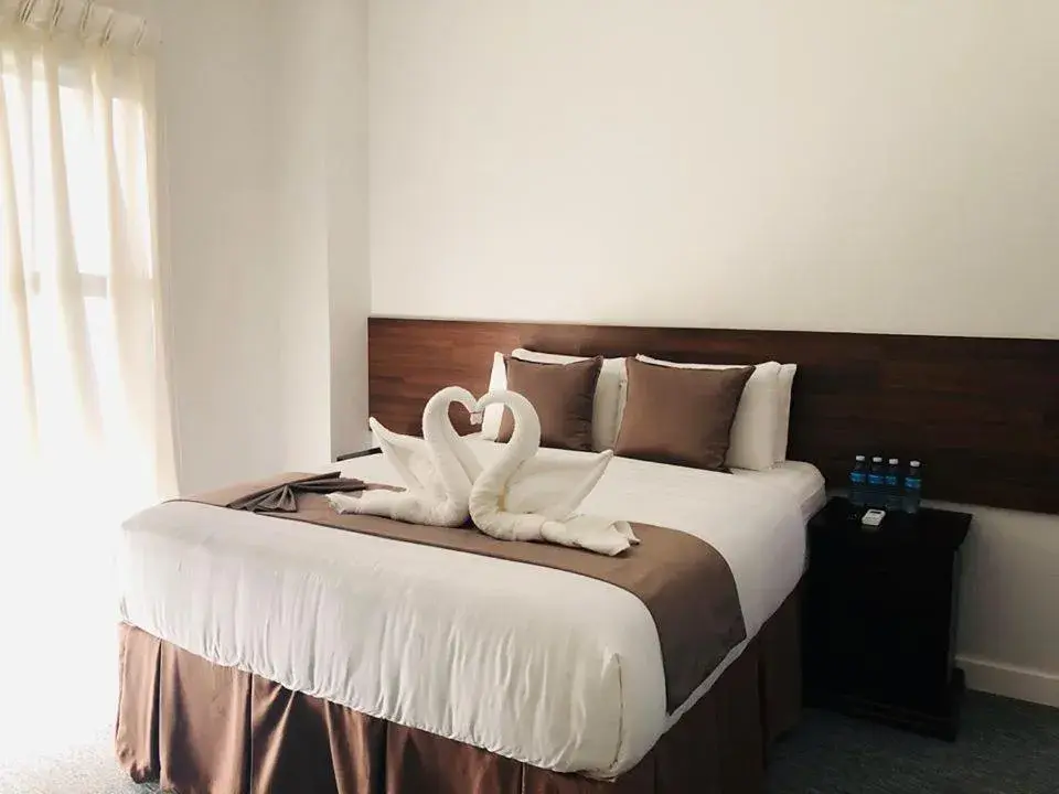 Bed in Seacliff Suites Hotel and Resort Bed in Seacliff Suites Hotel and Resort