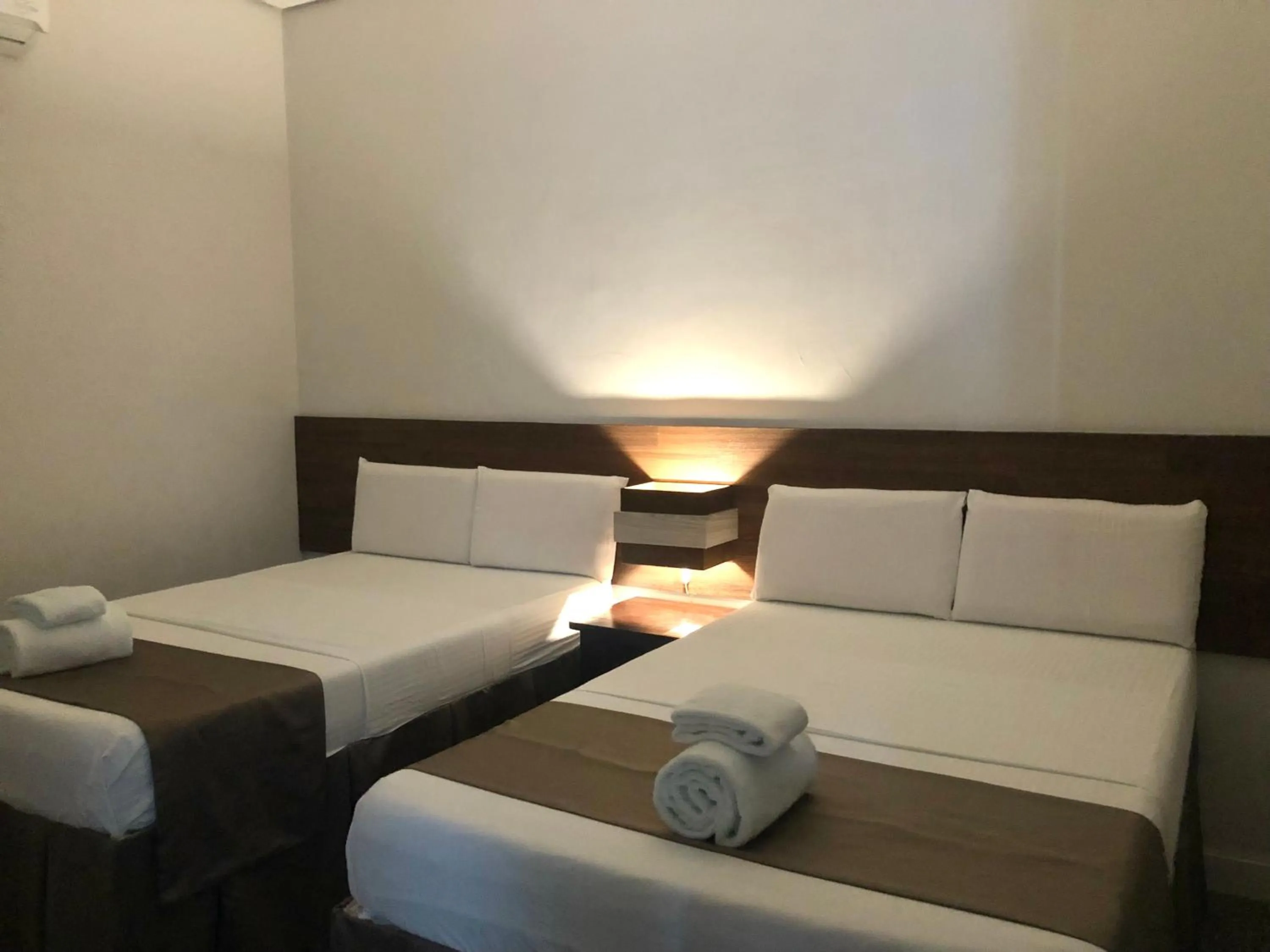 Bed in Seacliff Suites Hotel and Resort