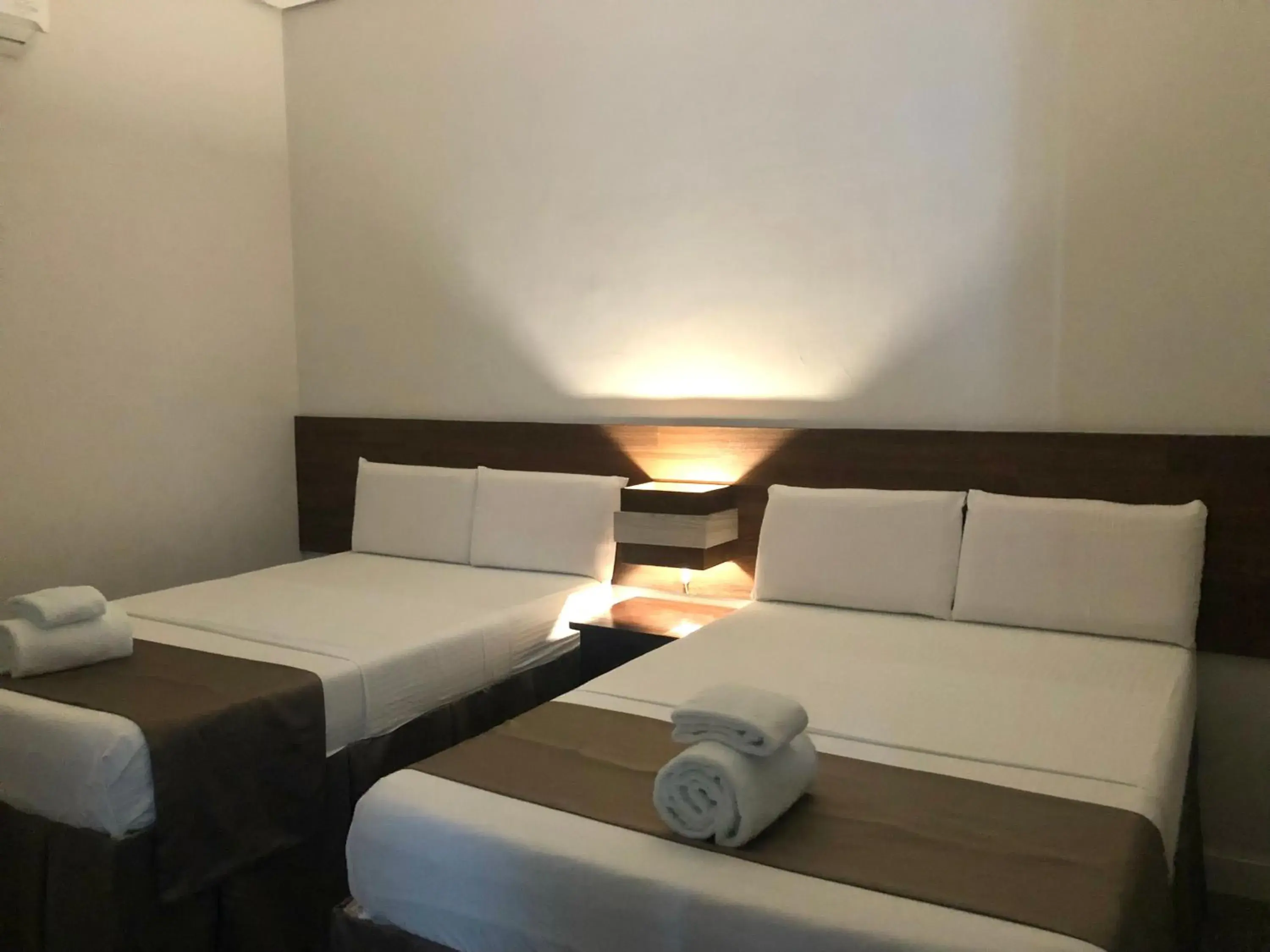 Bed in Seacliff Suites Hotel and Resort Bed in Seacliff Suites Hotel and Resort