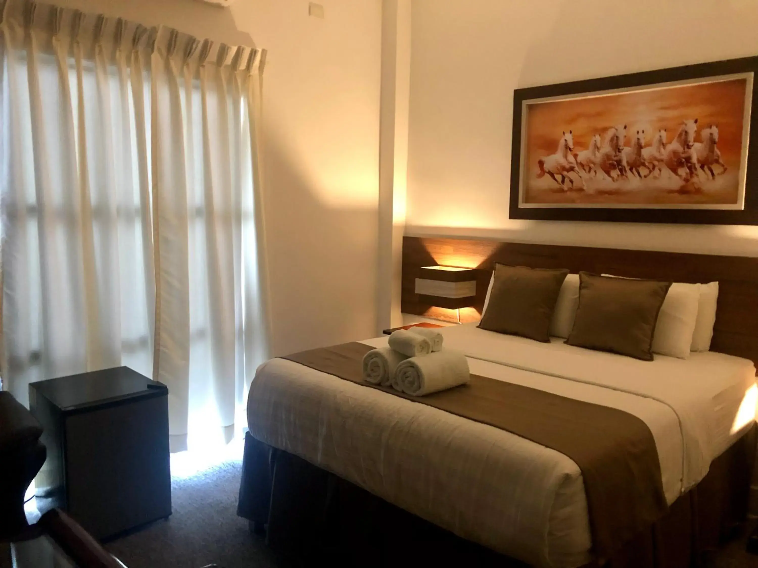 Bed in Seacliff Suites Hotel and Resort Bed in Seacliff Suites Hotel and Resort