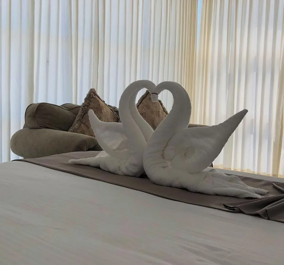 Bed in Seacliff Suites Hotel and Resort