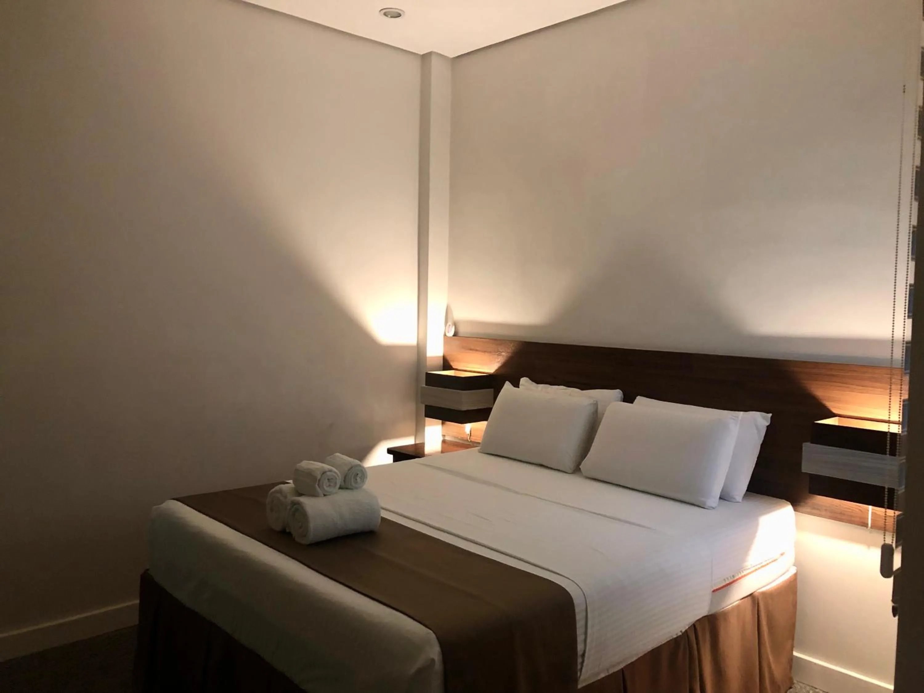 Bed in Seacliff Suites Hotel and Resort