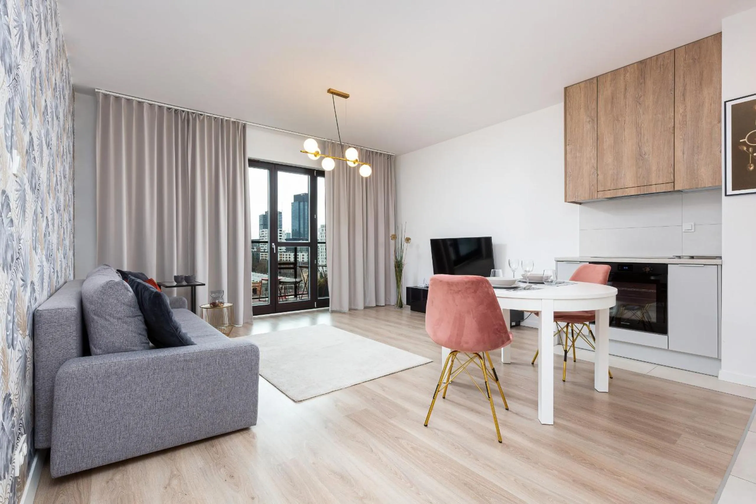 Communal lounge/ TV room in Metro Płocka Exquisite Apartments by Noclegi Renters