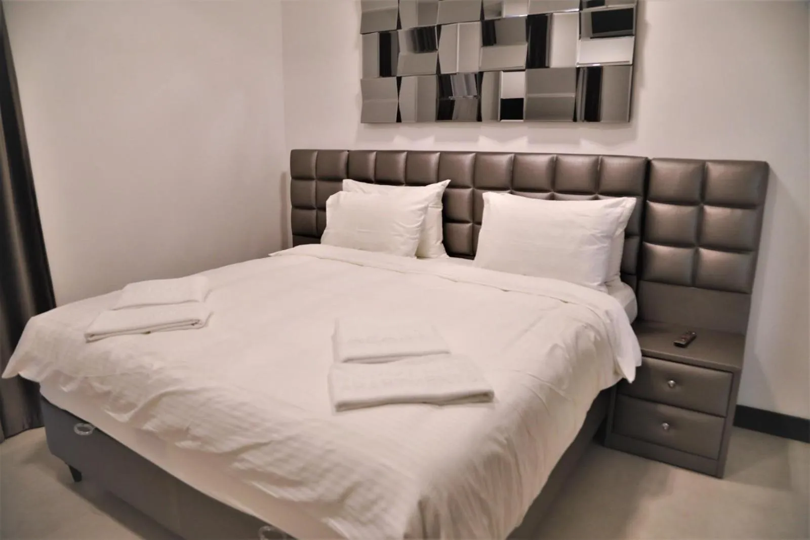 Bed in Enjoy Life Apartments