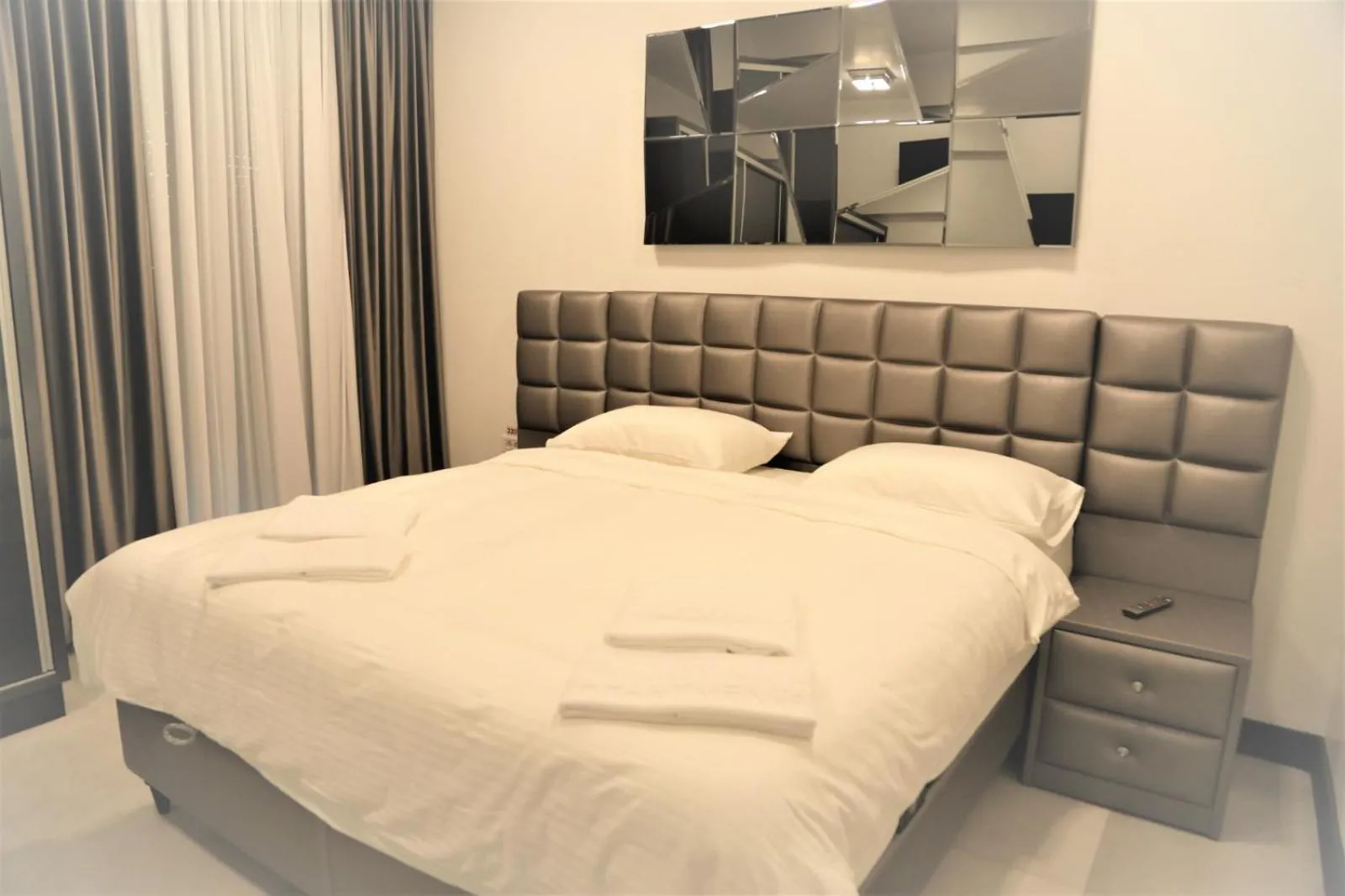 Bed in Enjoy Life Apartments