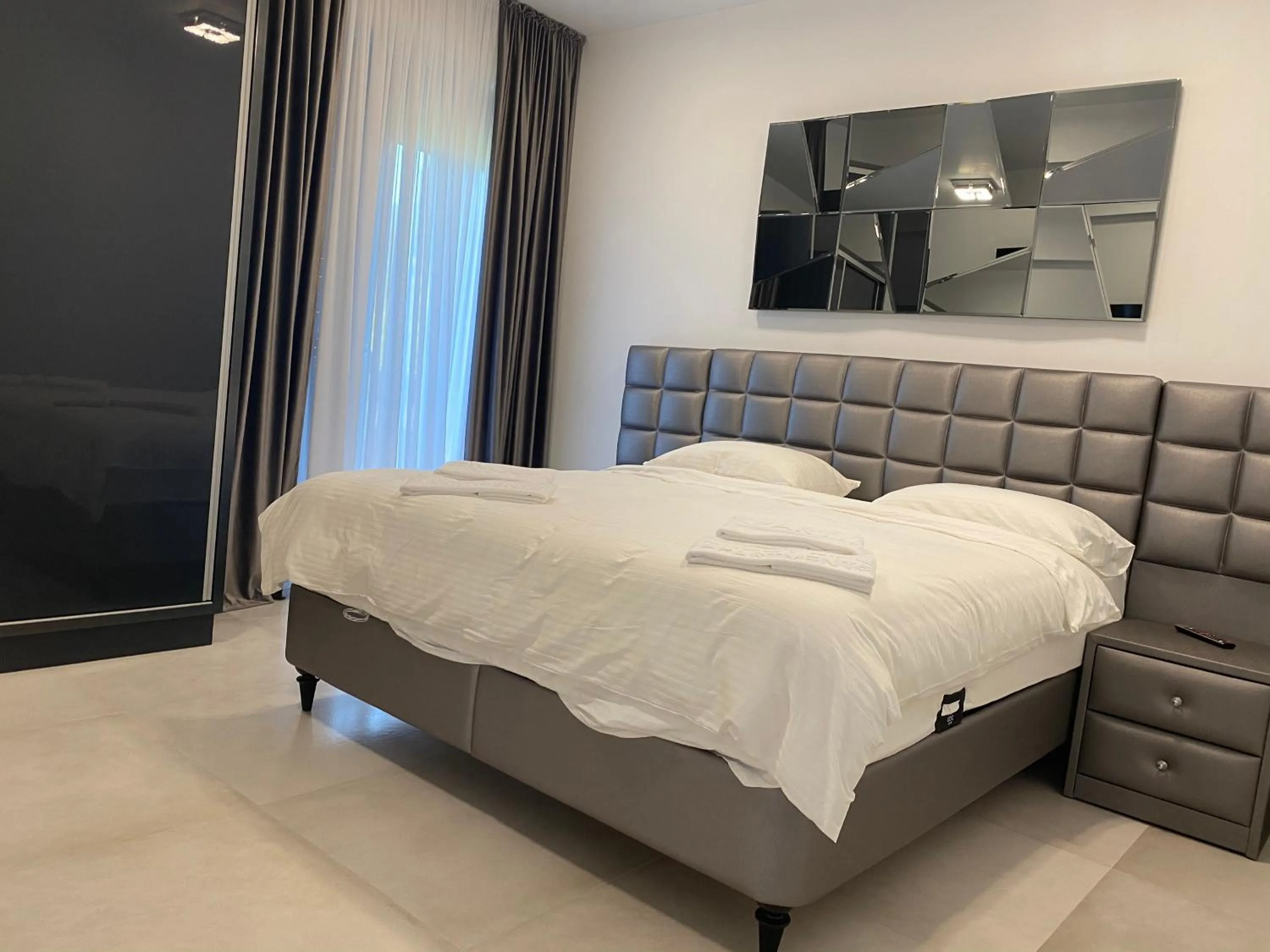 Bed in Enjoy Life Apartments