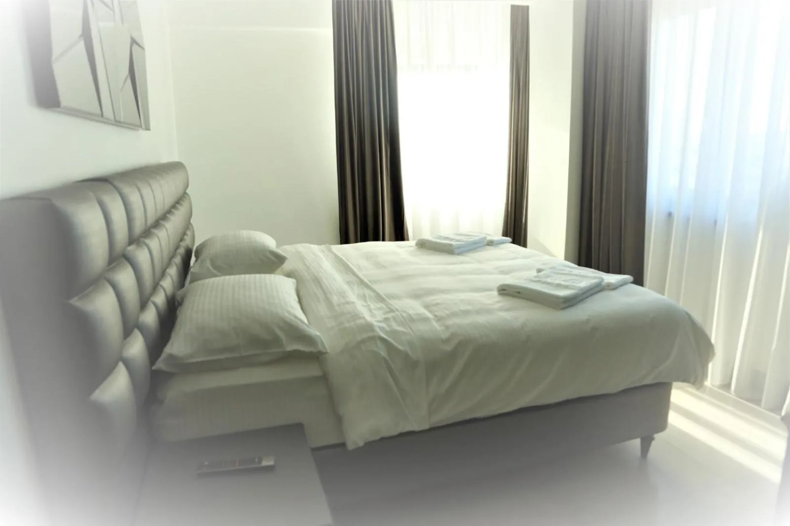 Bed in Enjoy Life Apartments