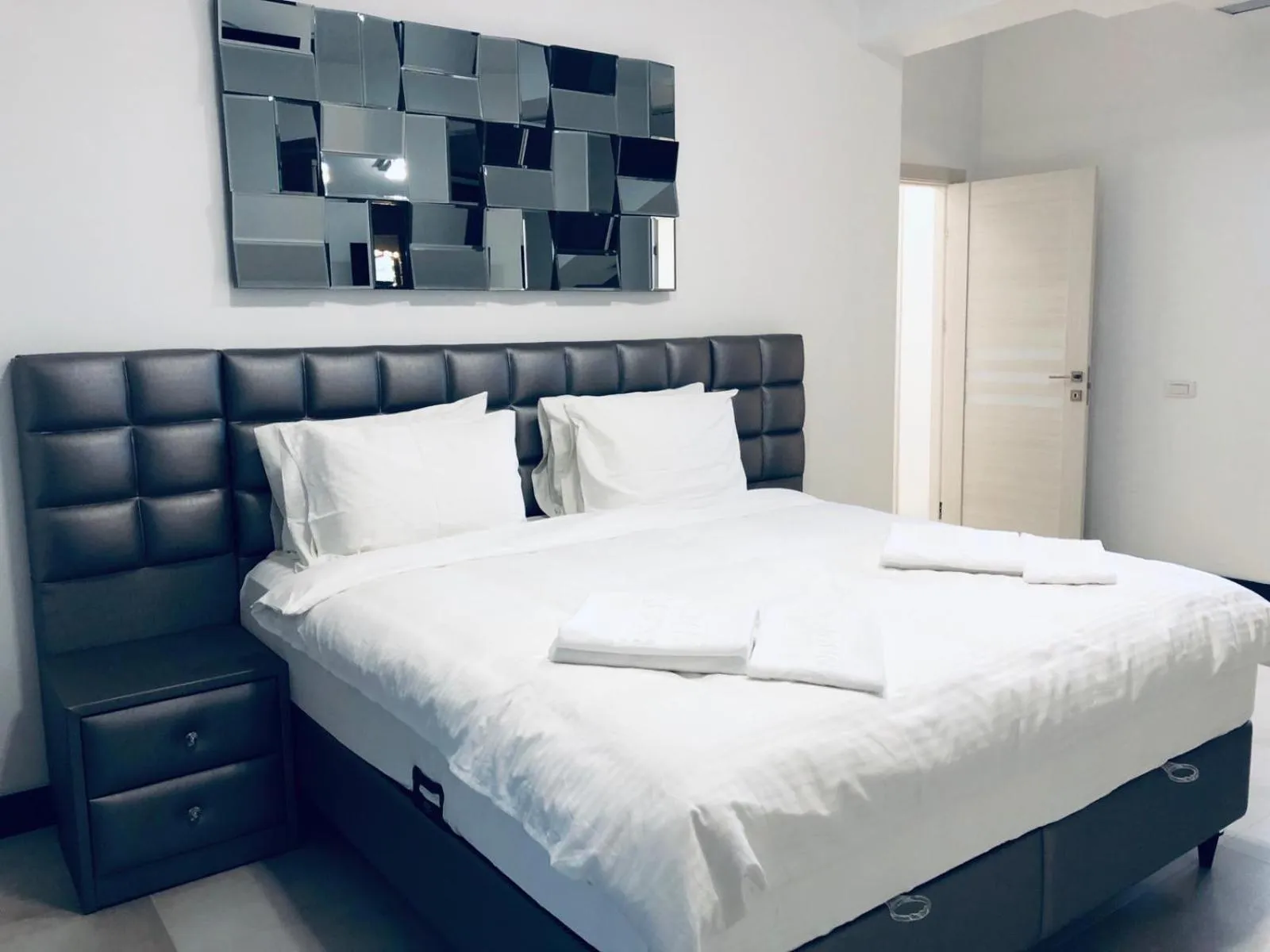 Bed in Enjoy Life Apartments