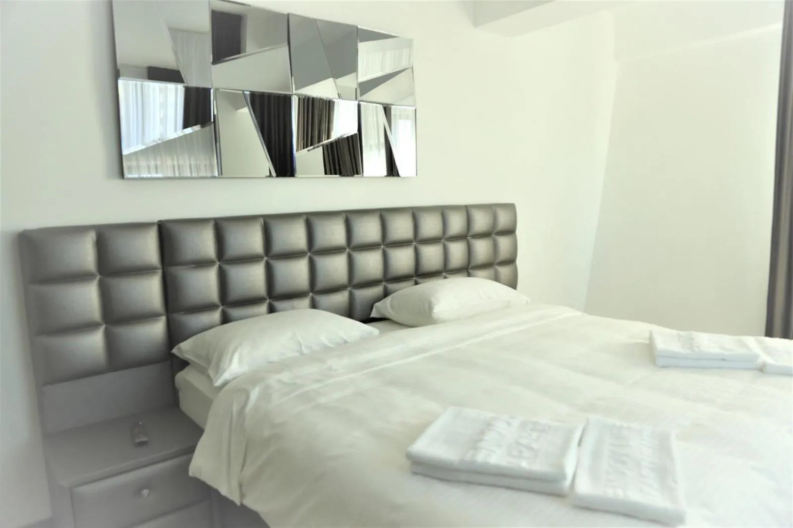 Bed in Enjoy Life Apartments