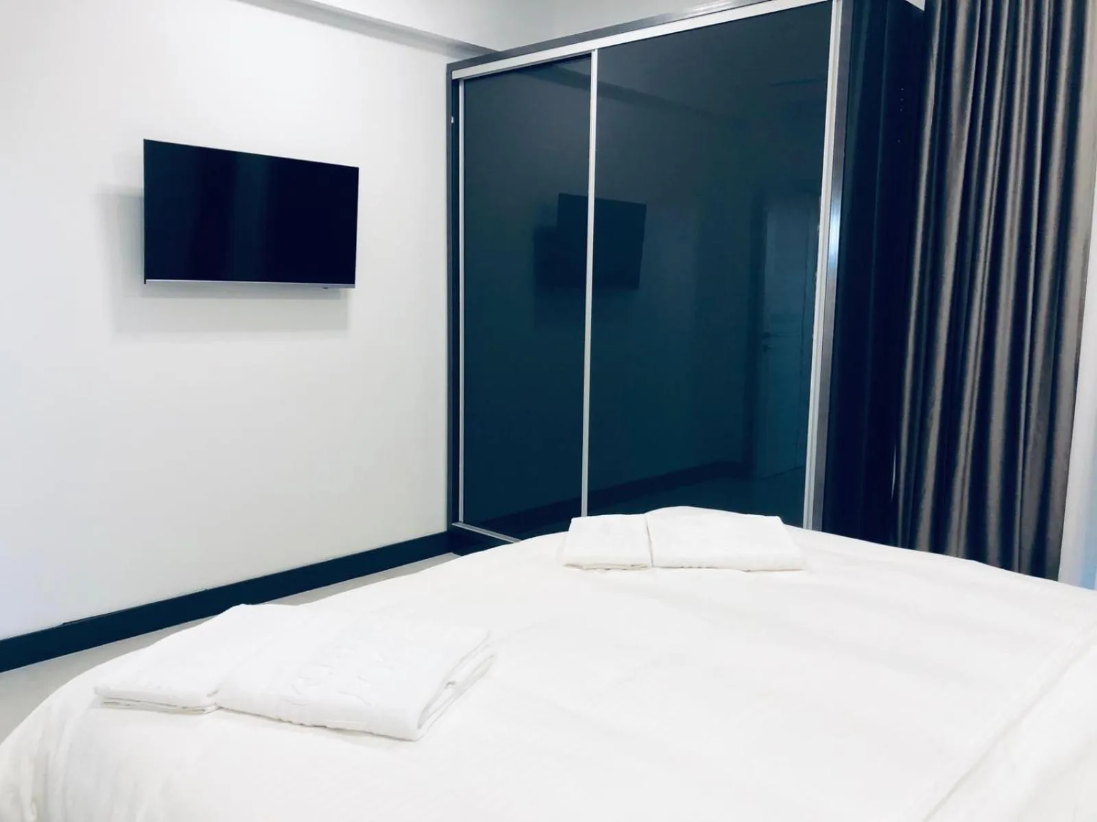 Bed in Enjoy Life Apartments