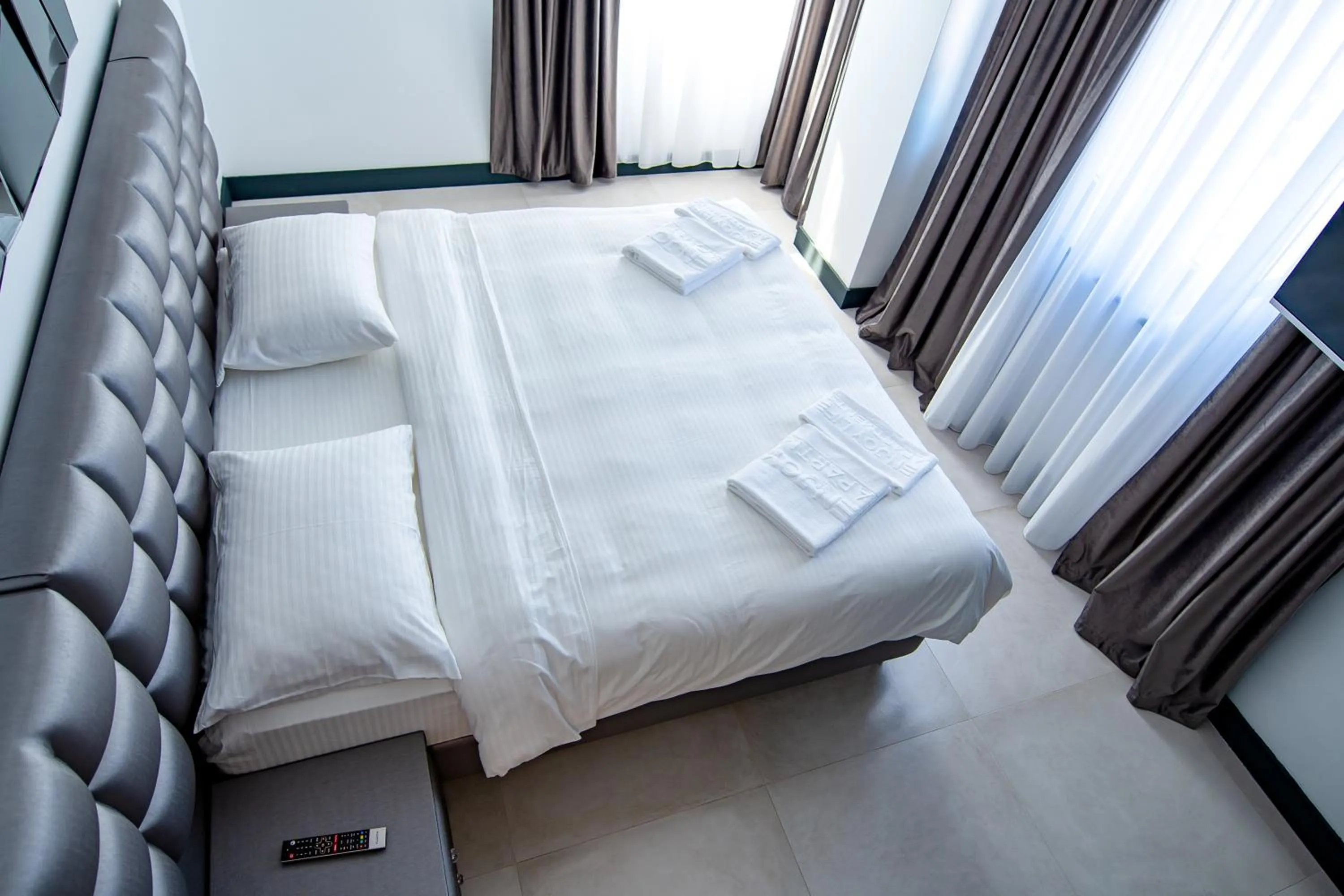 Bed in Enjoy Life Apartments