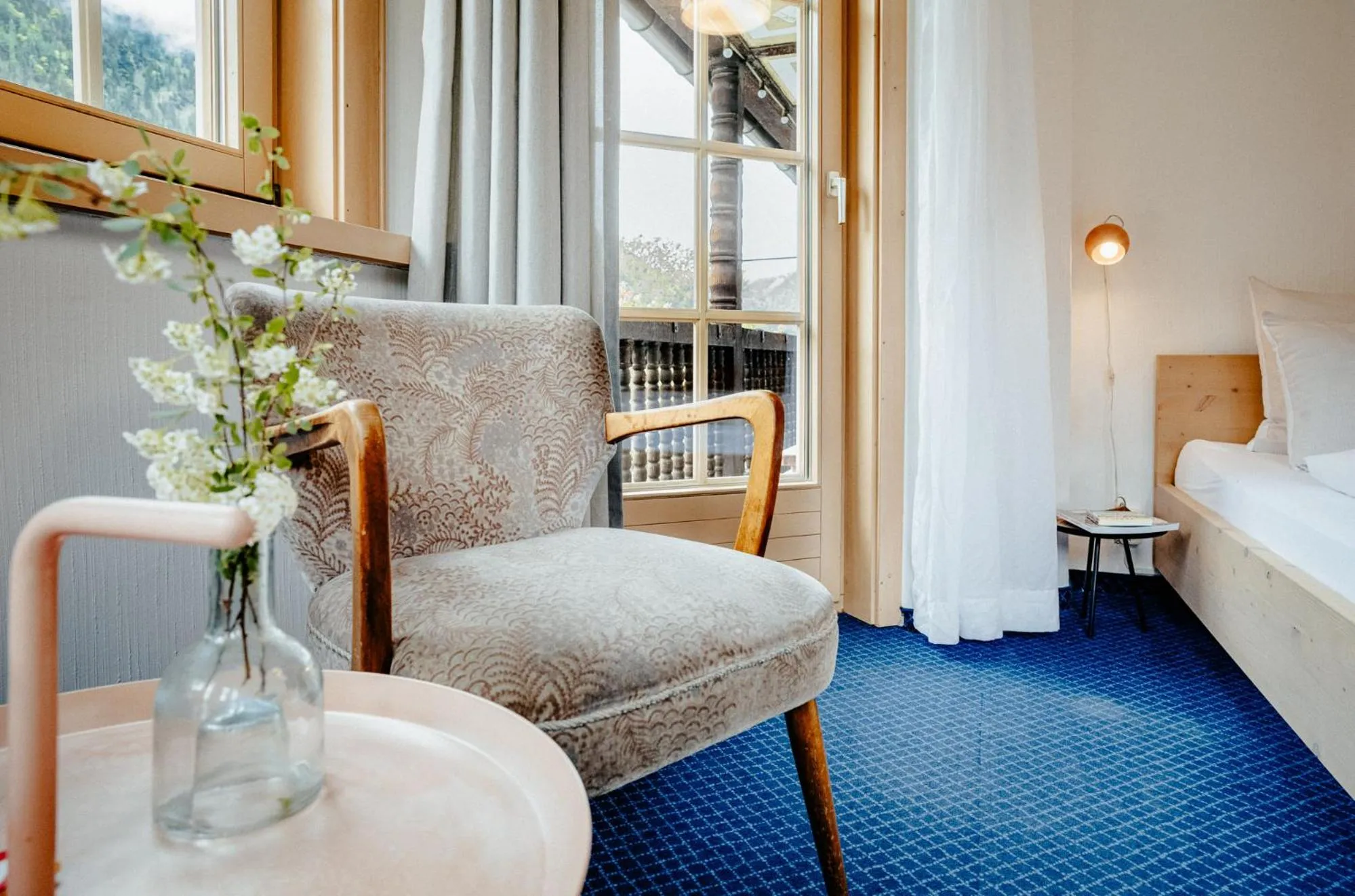 Seating area, Bed in Alpenrose Bayrischzell Hotel