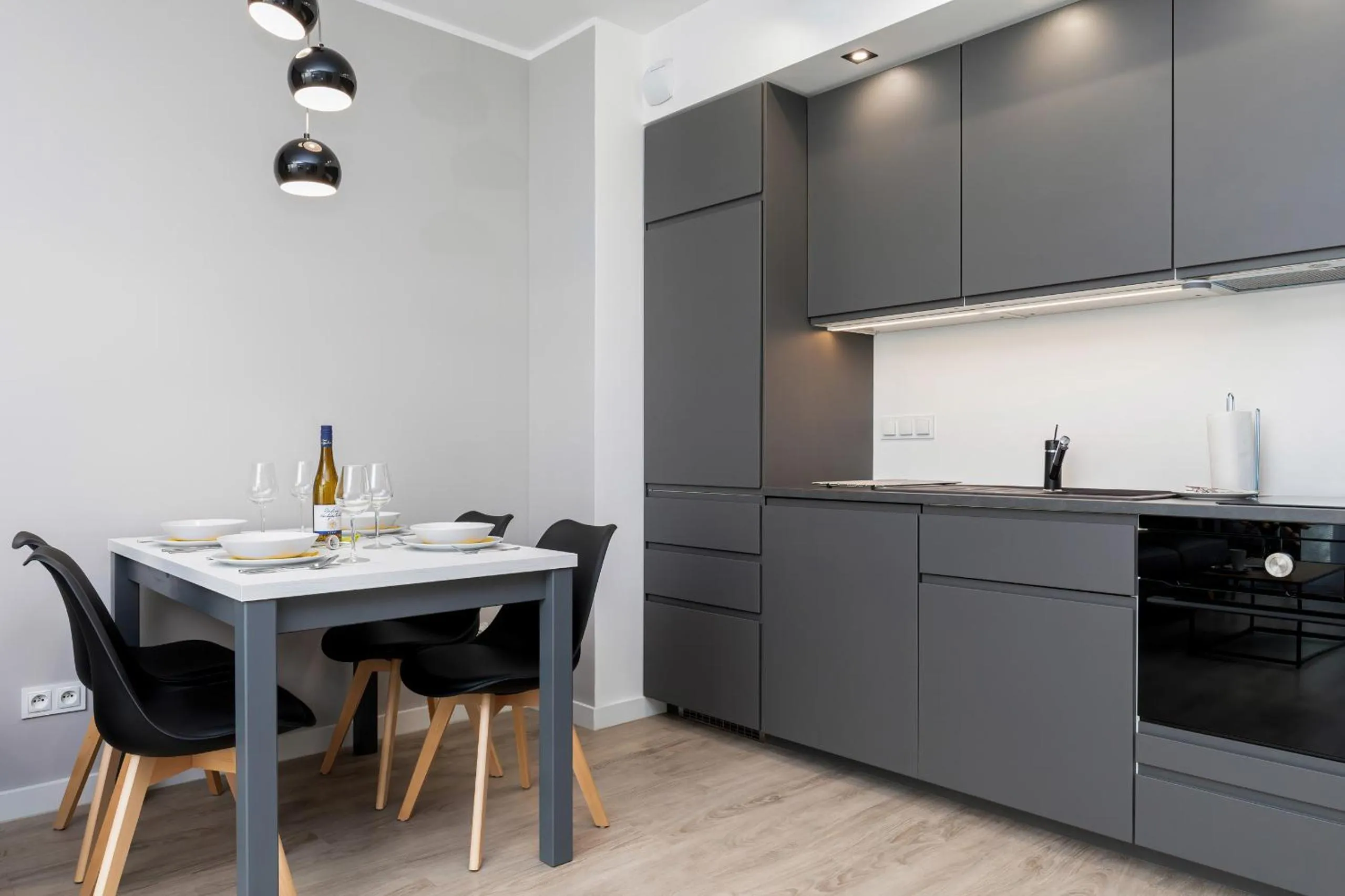 Kitchen or kitchenette in Modern City Center Apartments by Noclegi Renters