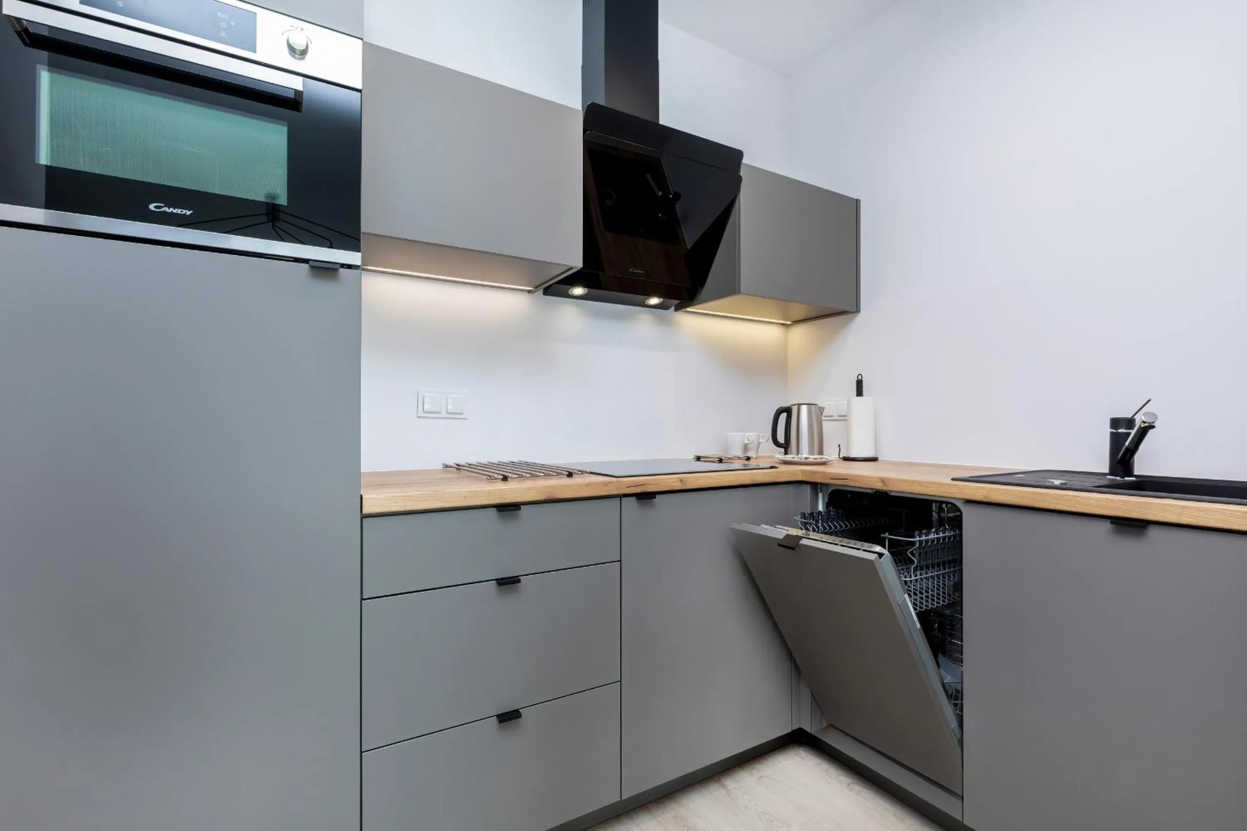 Kitchen or kitchenette in Modern City Center Apartments by Noclegi Renters